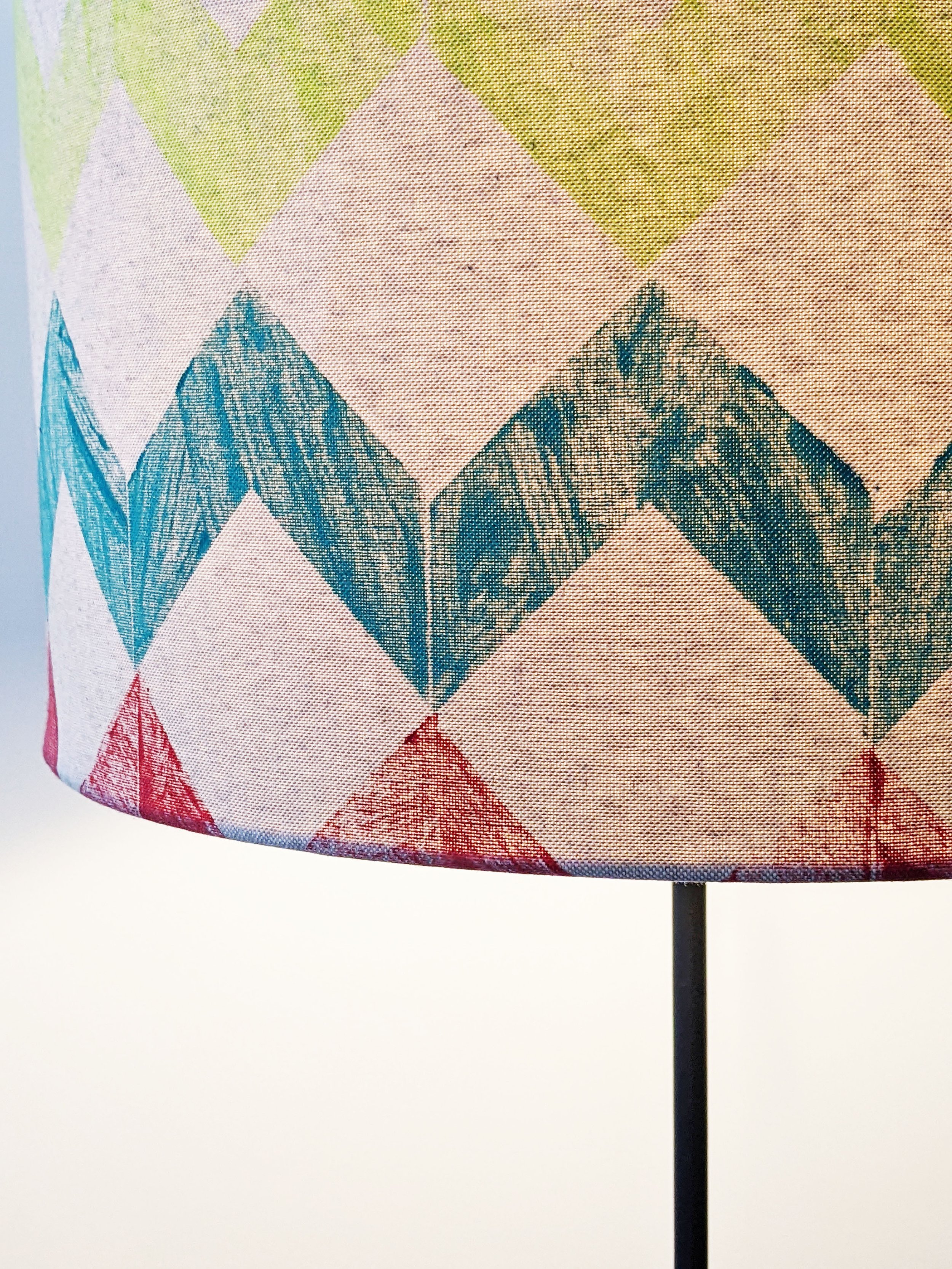 colourful hand printed zig-zag striped on lampshade with light on