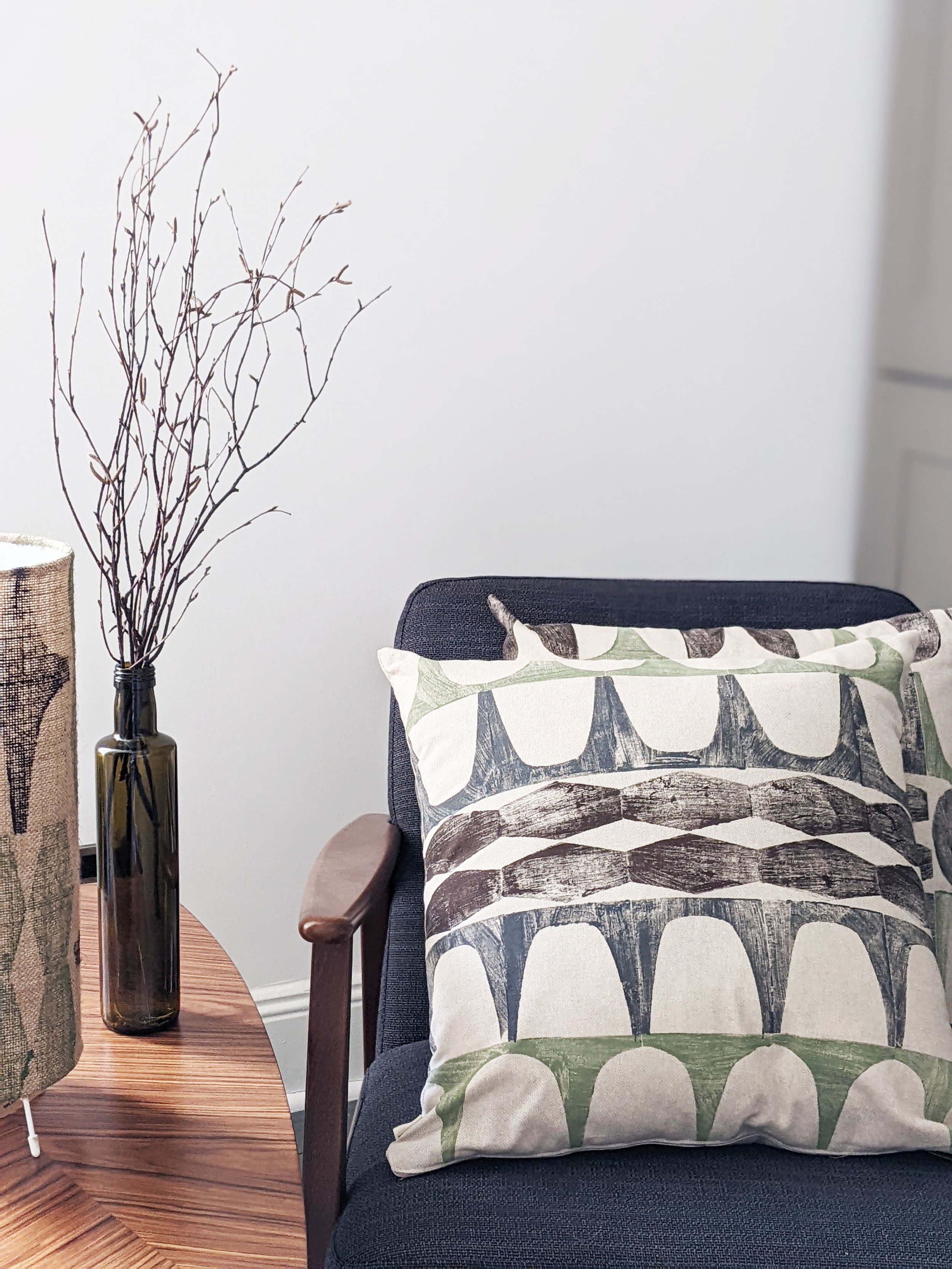mid-century modern living room scene with hand printed cushions on seat