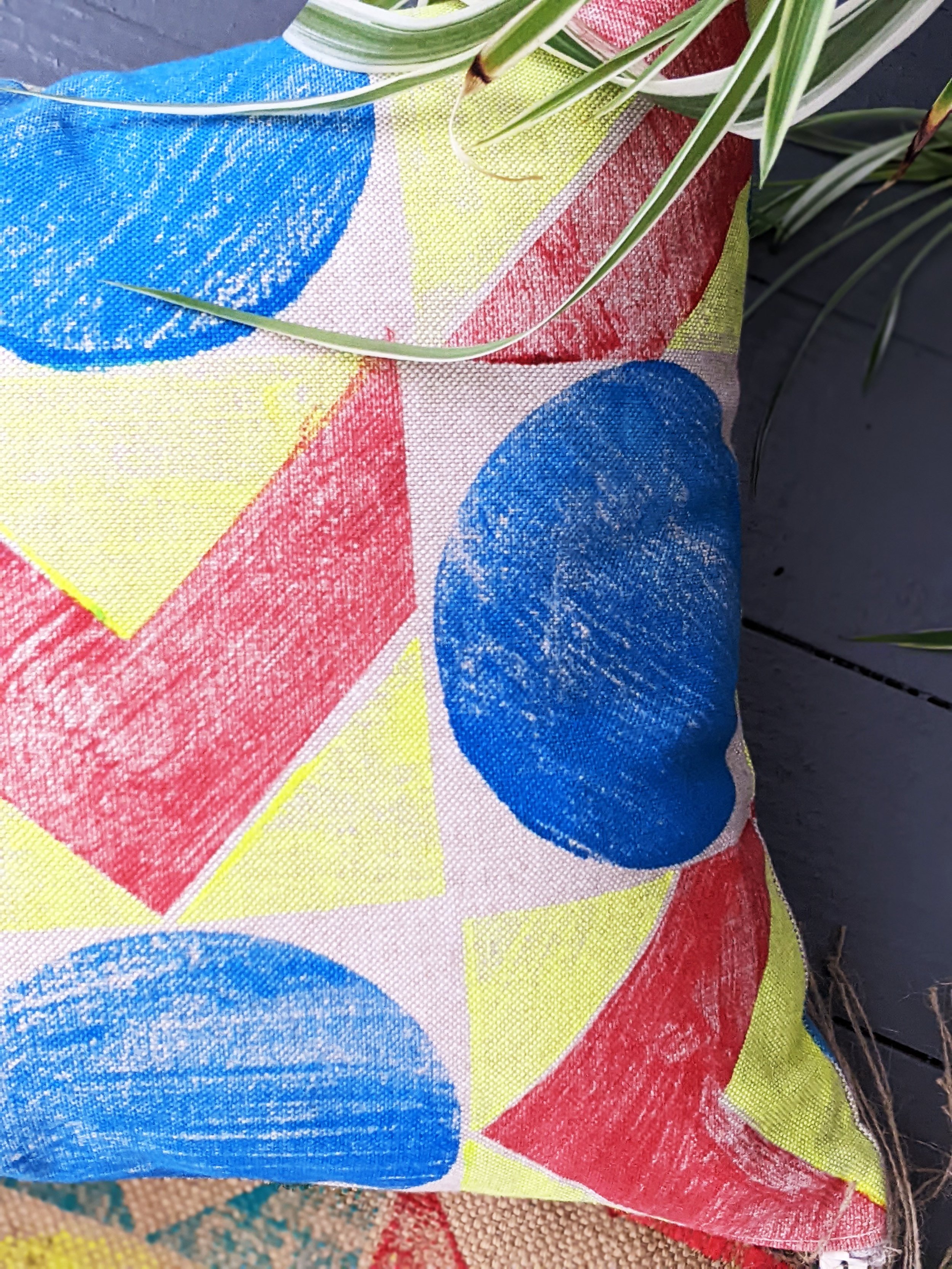 close-up-details of hand block printed geometric colourful pattern on cushion