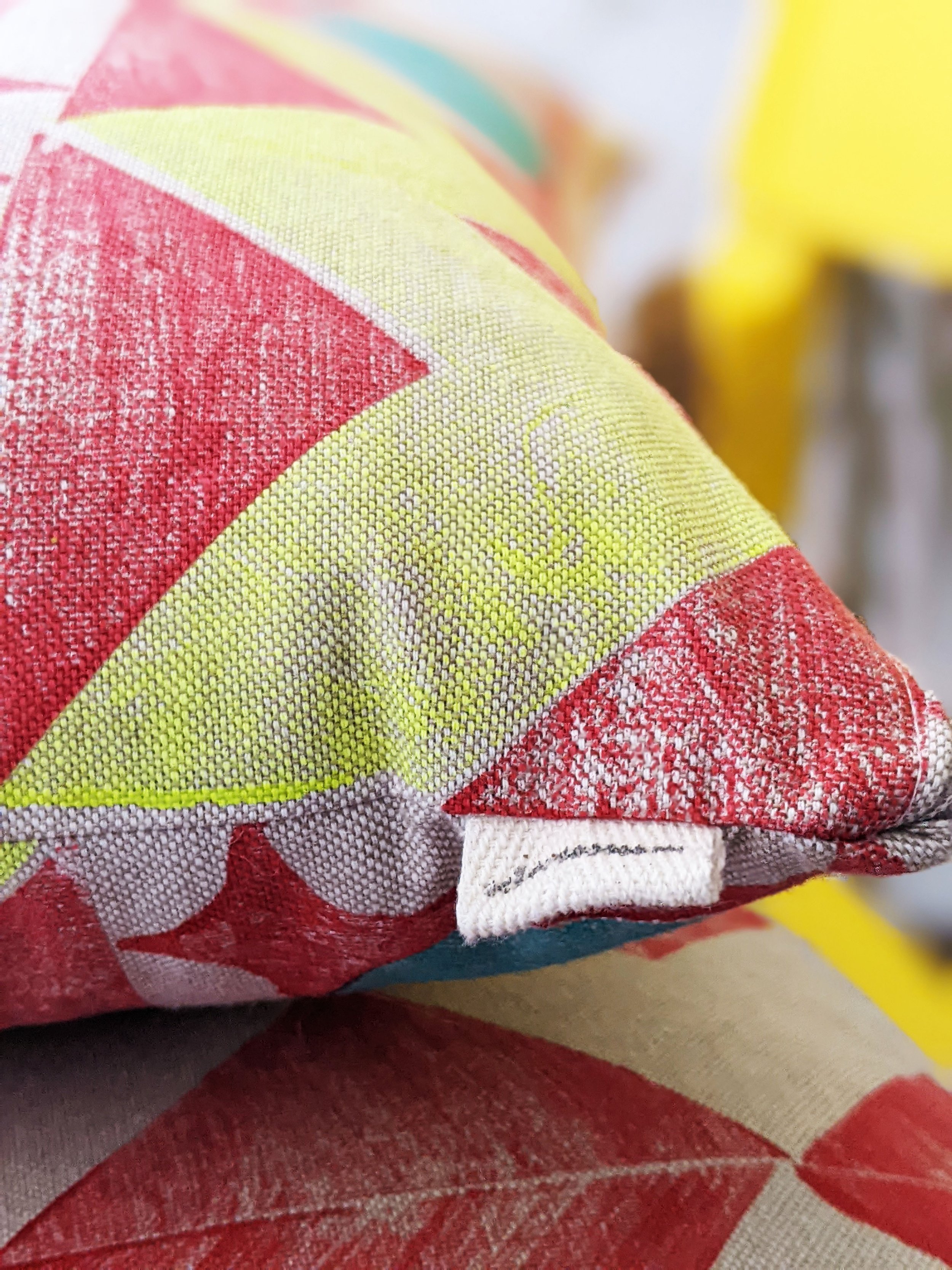 close-up detail of hand block printed chevron pattern on cotton cushion