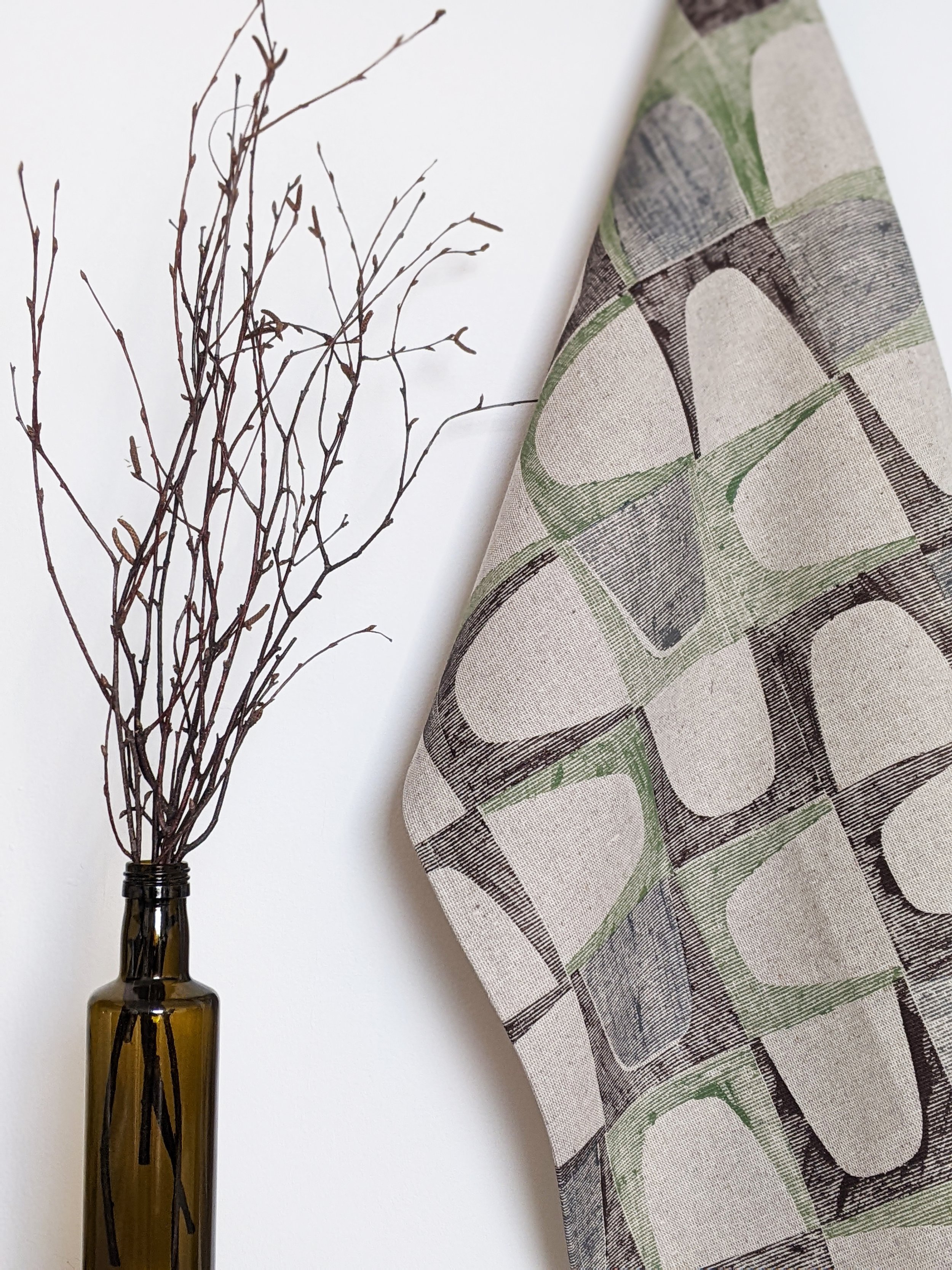 mid-century modern inspired pattern on contemporary teatowels hanging