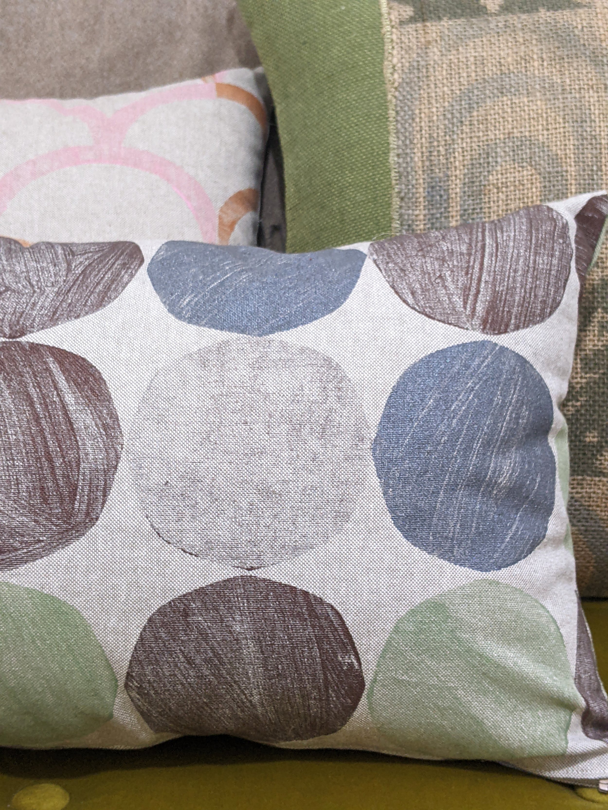 bold mid-century modern inspired abstract geometric print on rectangular cushion, close-up