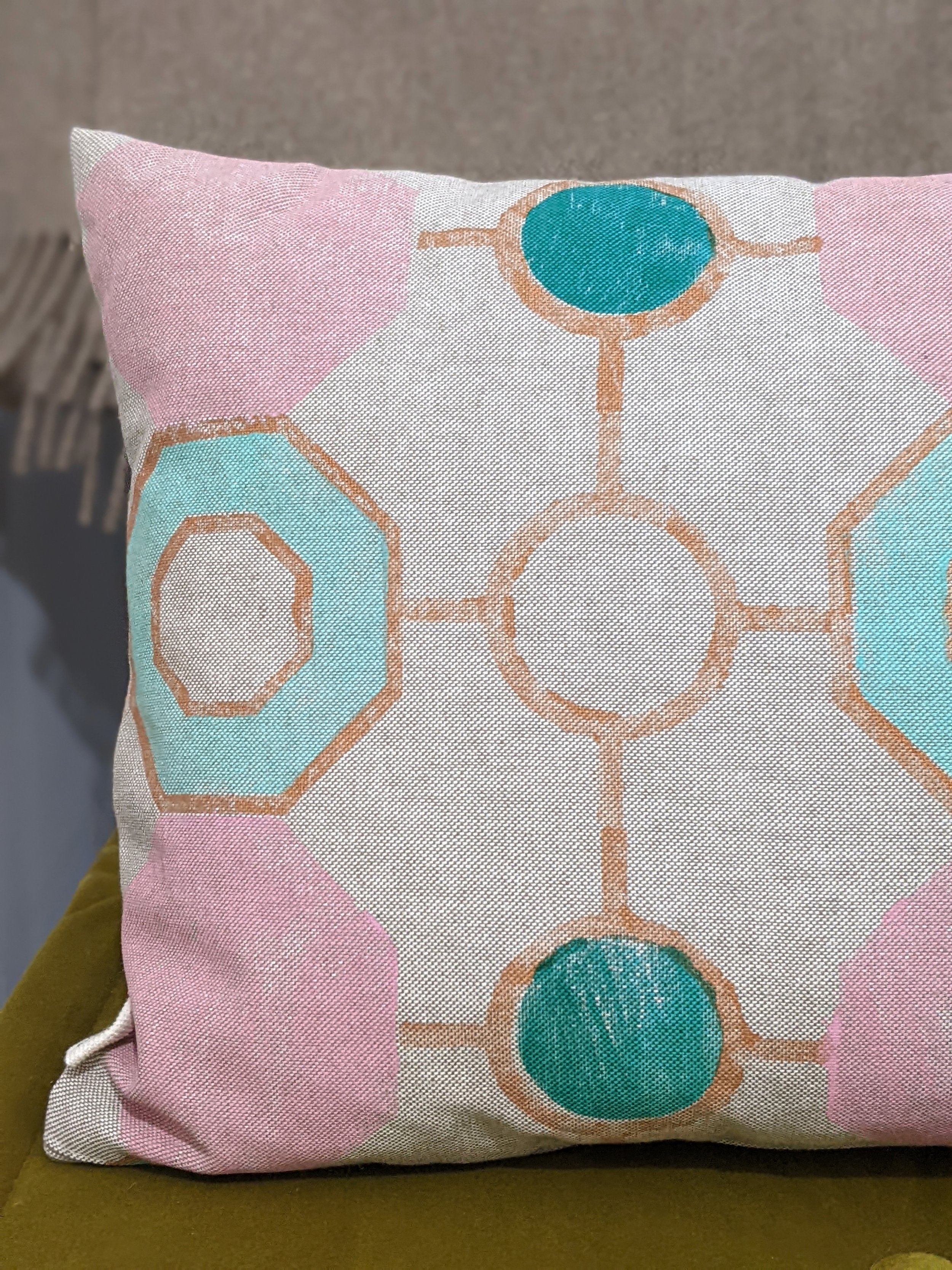 close-up detail of vintage inspired block print on cushion