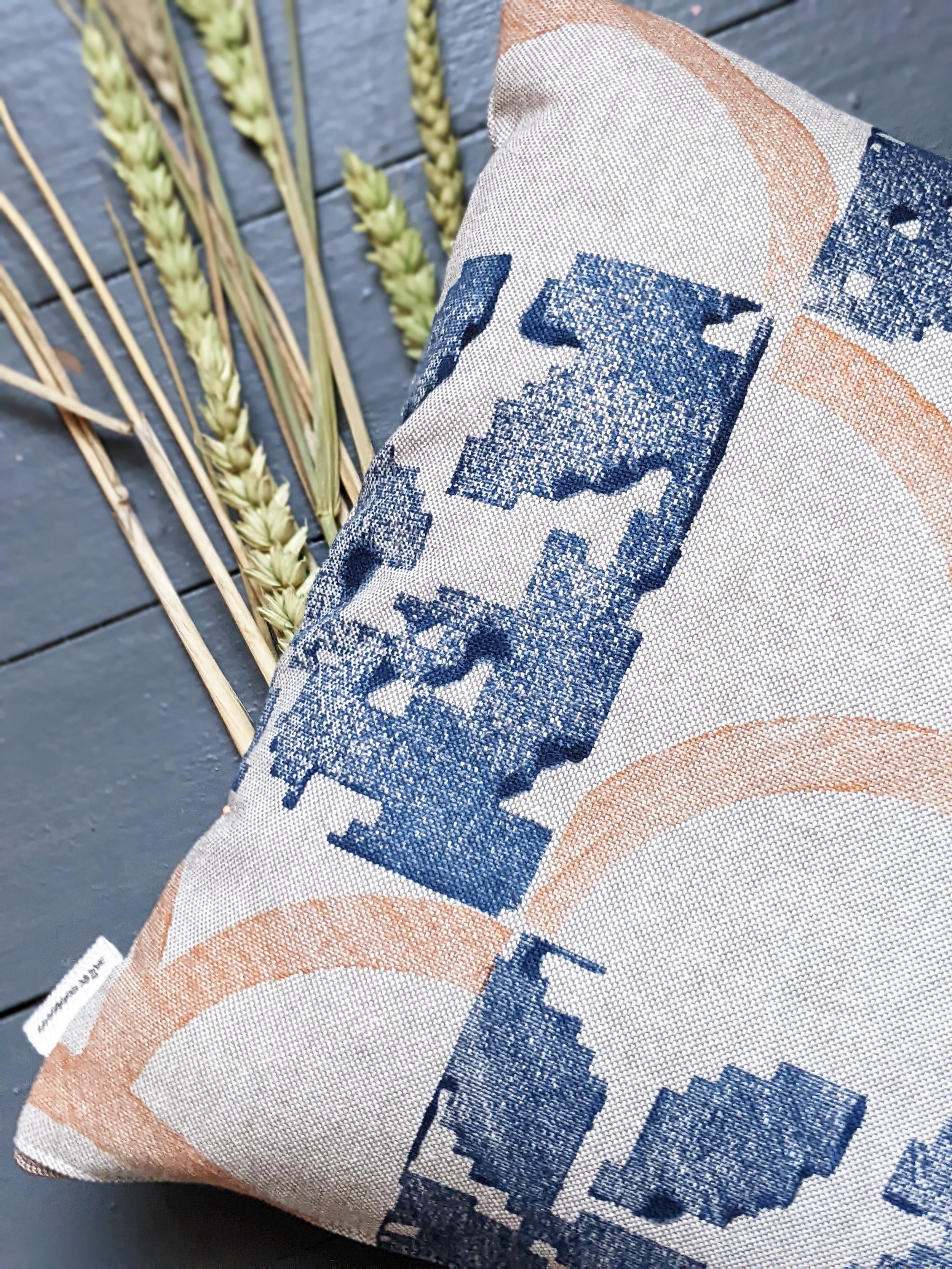close-up detail of block printed pattern on small cushion