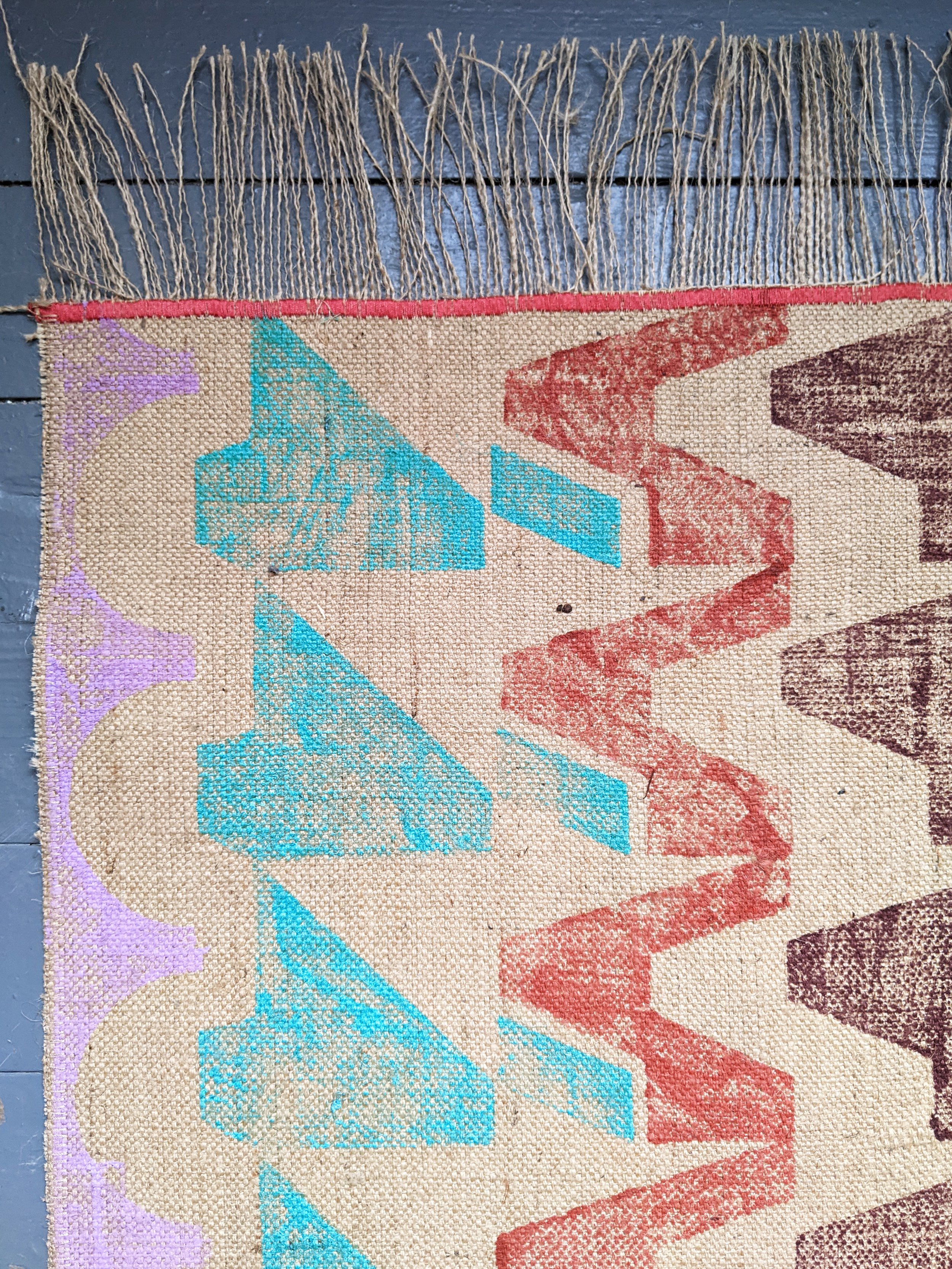 detail of brutalist architecture-inspired geometric print on long runner rug