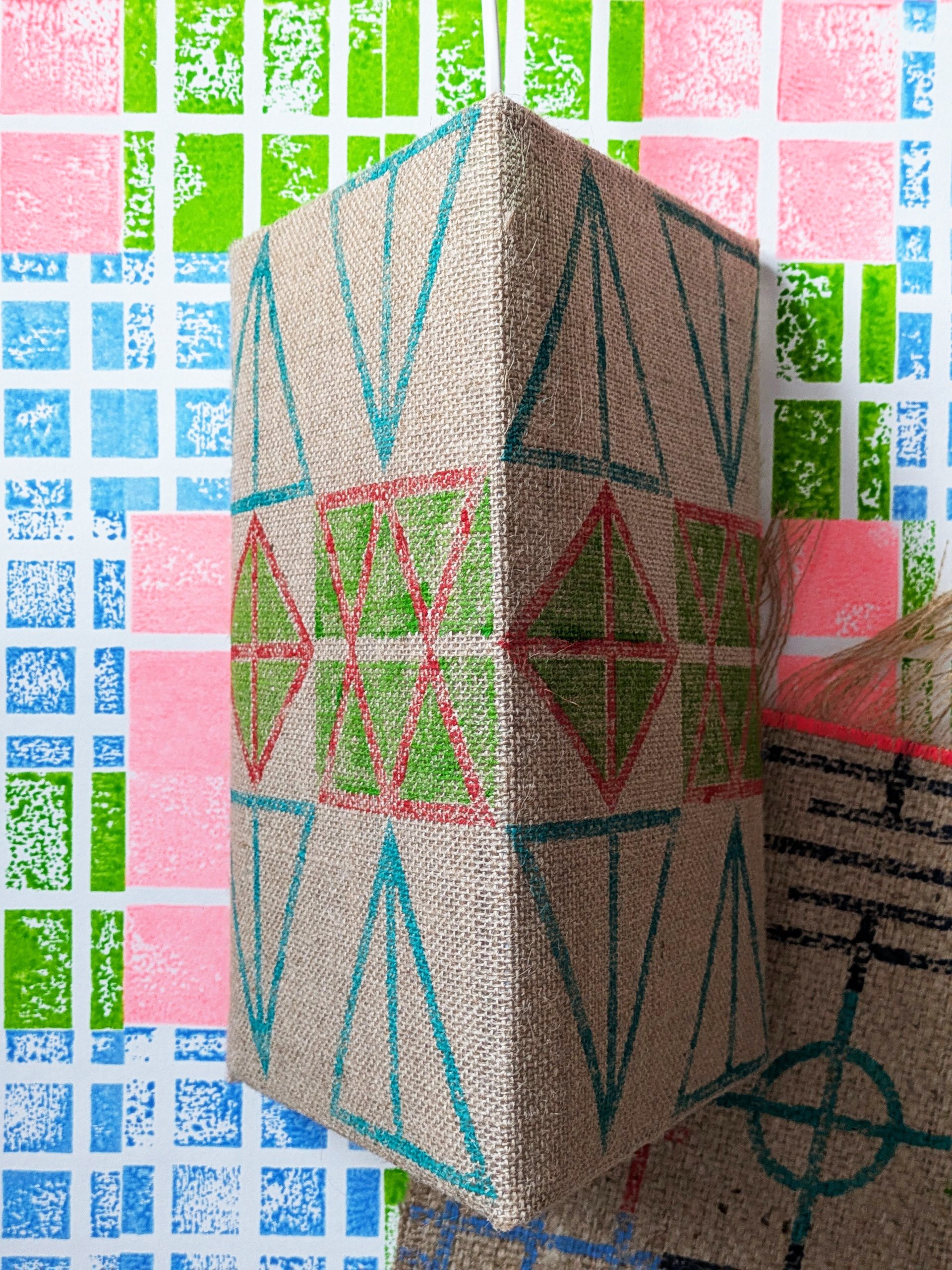 graphic bold triangular lampshade on bright wall