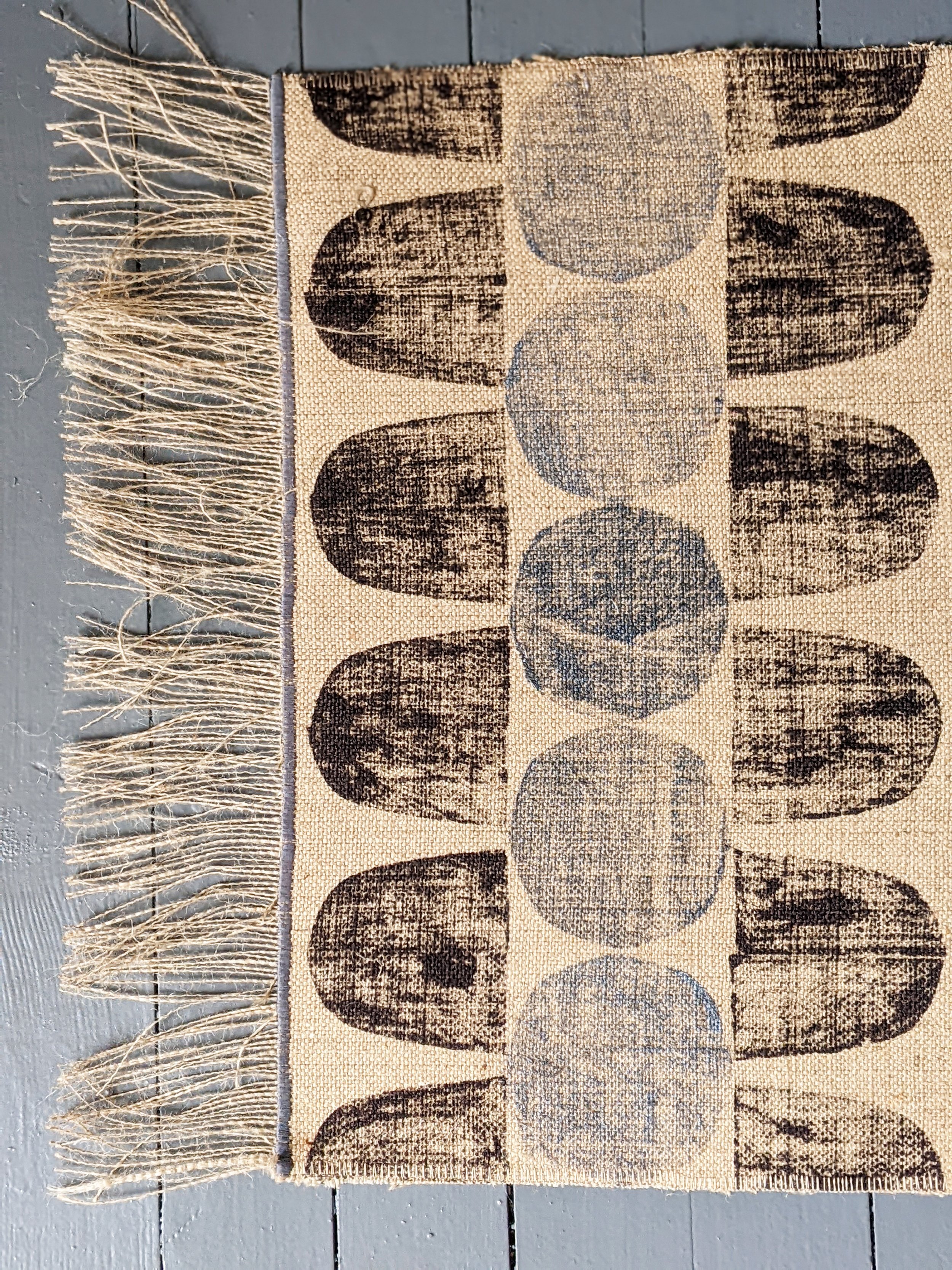 close-up detail of abstract geometric printed runner rug in mid-century-modern style