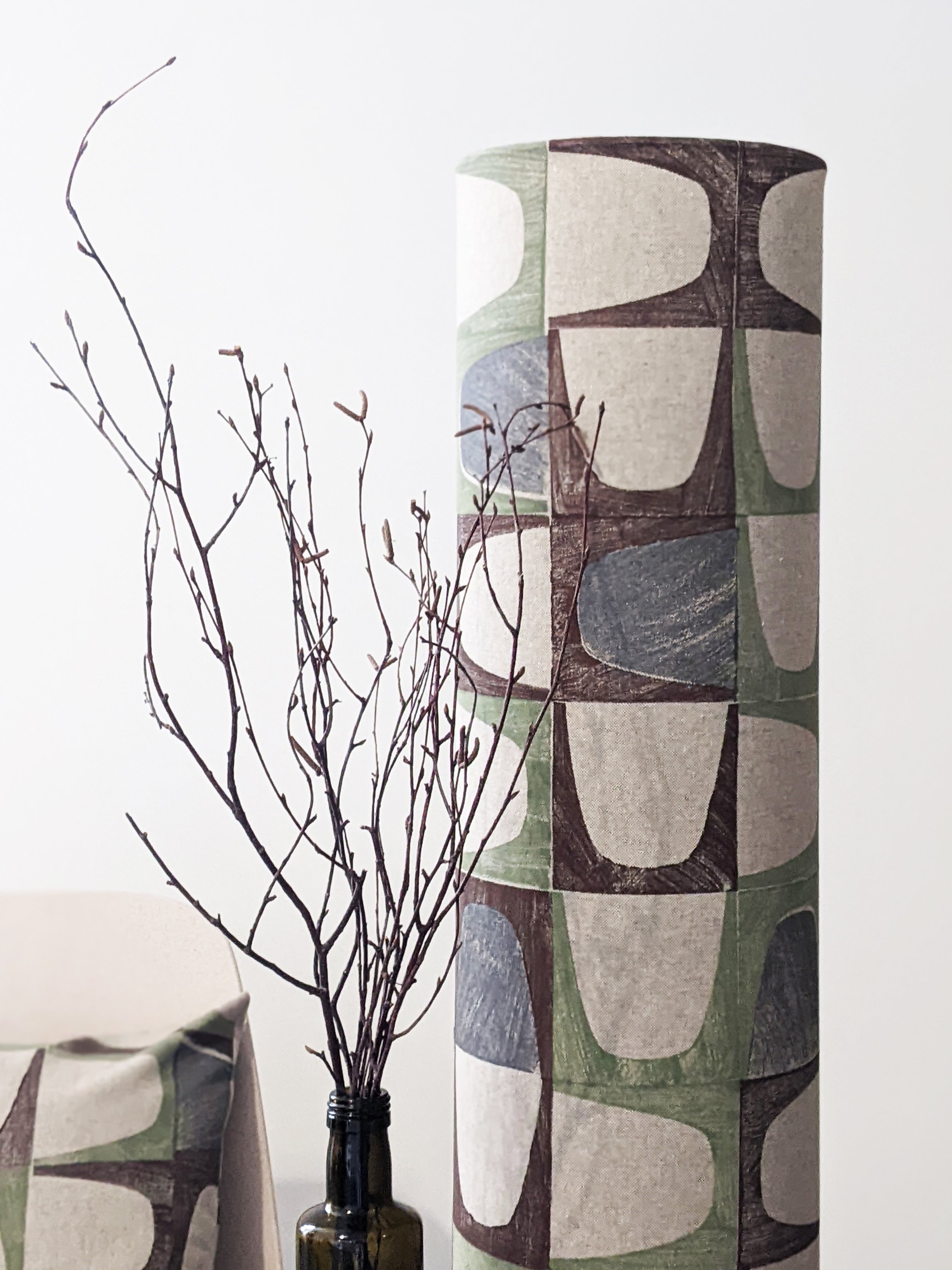 mid-century-modern inspired print on large floor lamp in warm earth tones