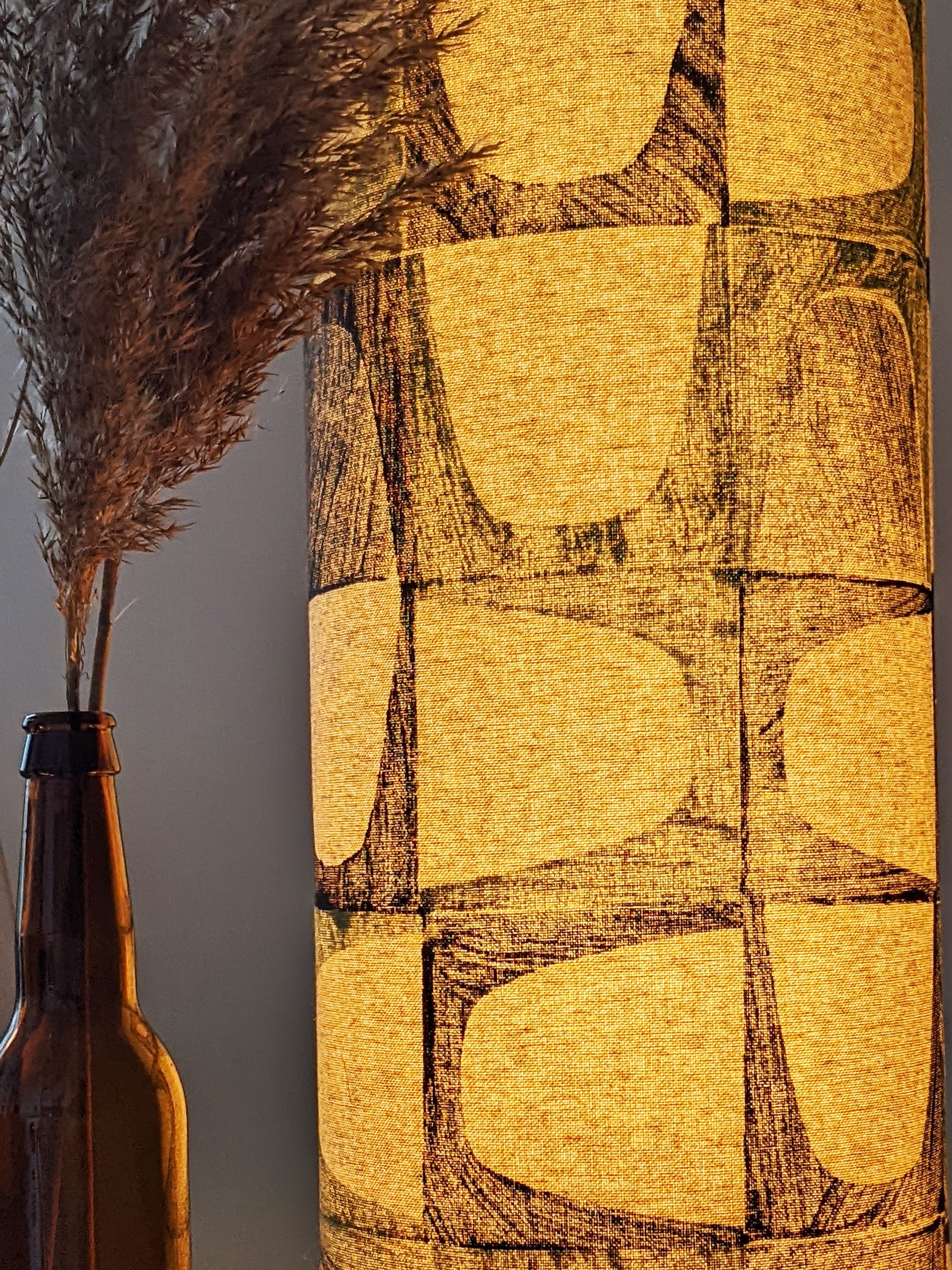 close-up detail of hand block printed geometric floor lamp in mid-century-modern inspired print coming through on illuminated floor lamp