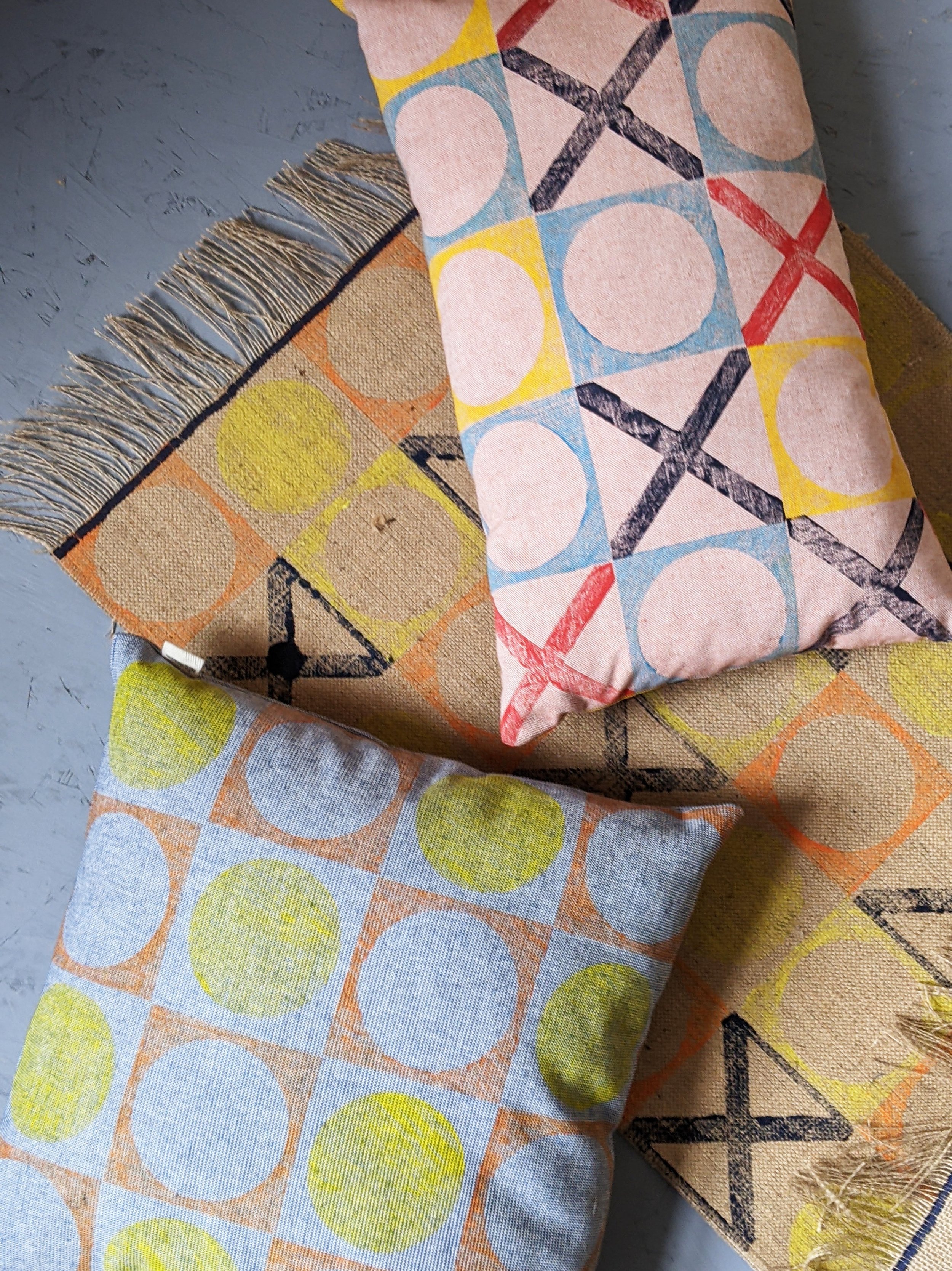 geometric, retro-inspired patterns on cushions and rugs