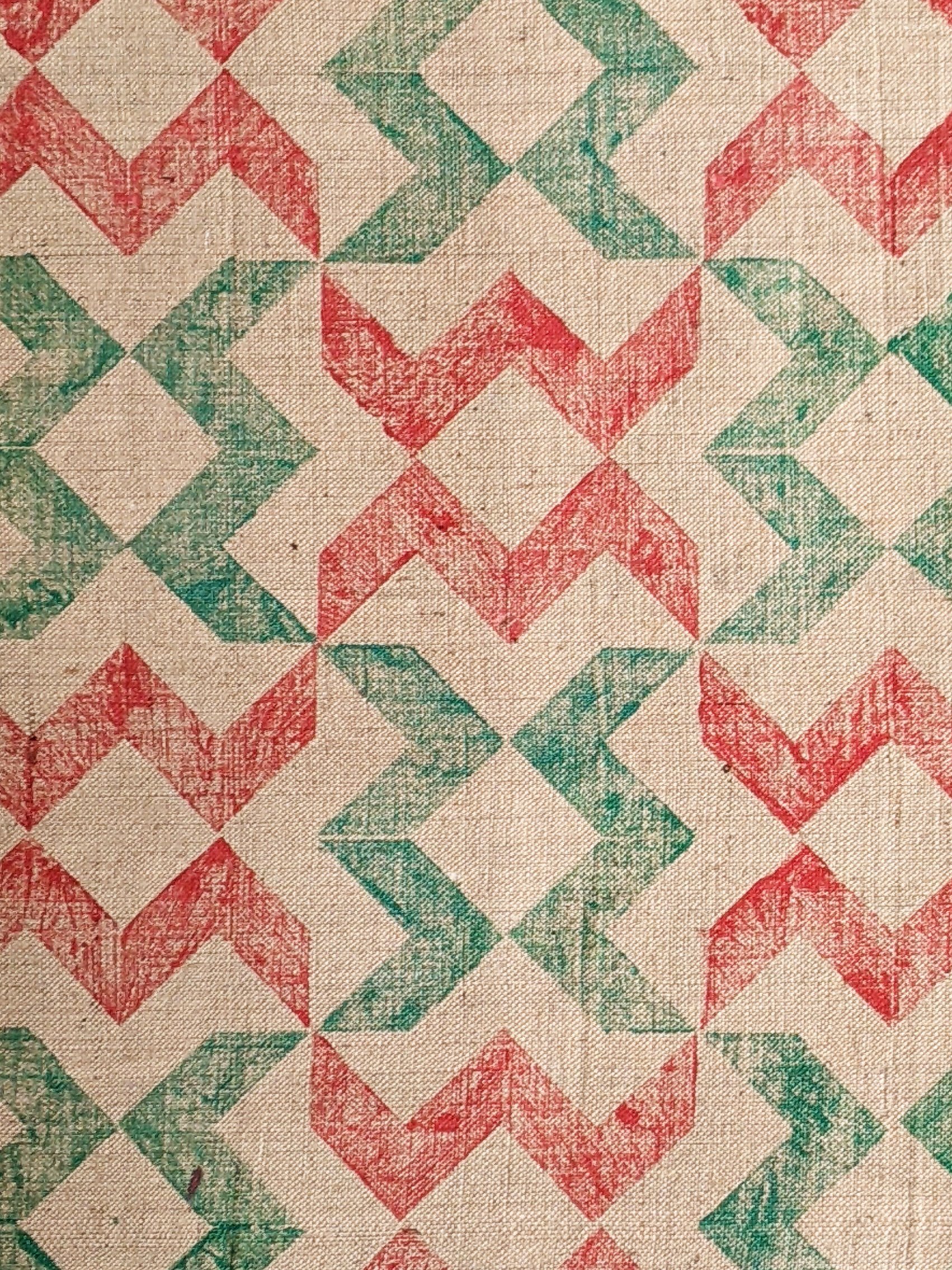 zig-zag chevron printed pattern on natural jute in bright red and apple green