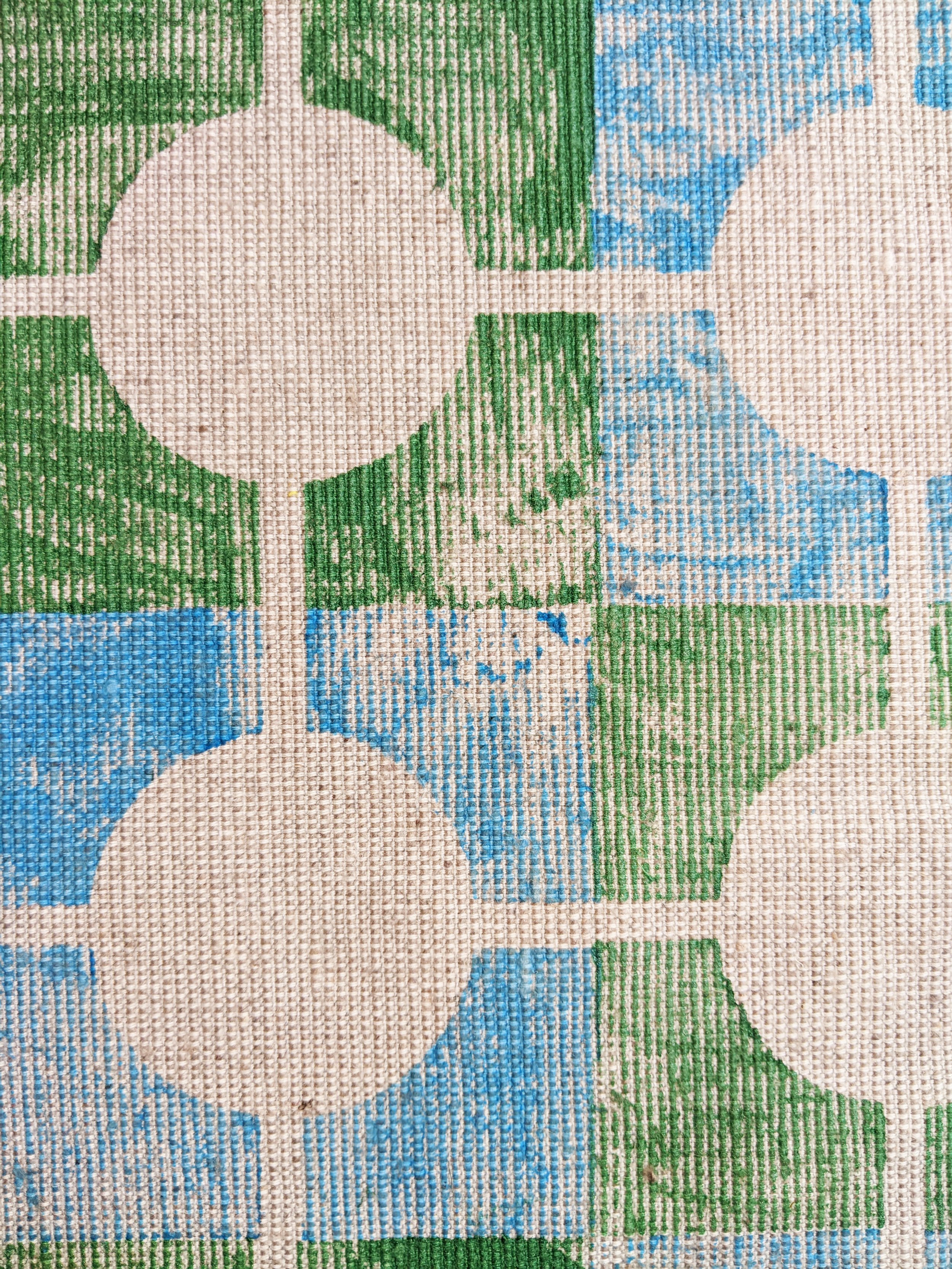close-up detail of hand printed fabric pattern in geometric design