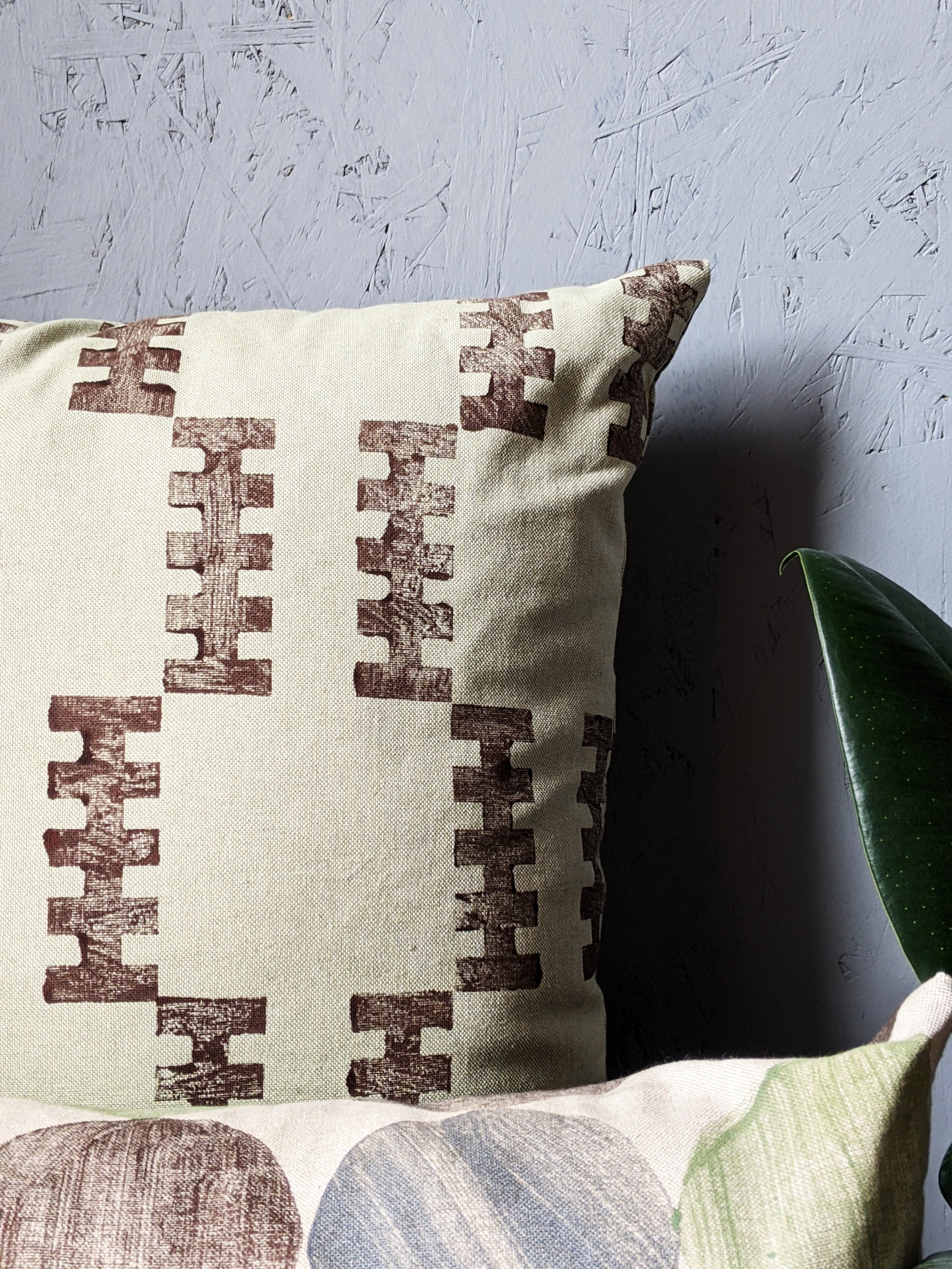 close-up detail of hand block printed pattern on sage cotton on brutalism inspired cushion