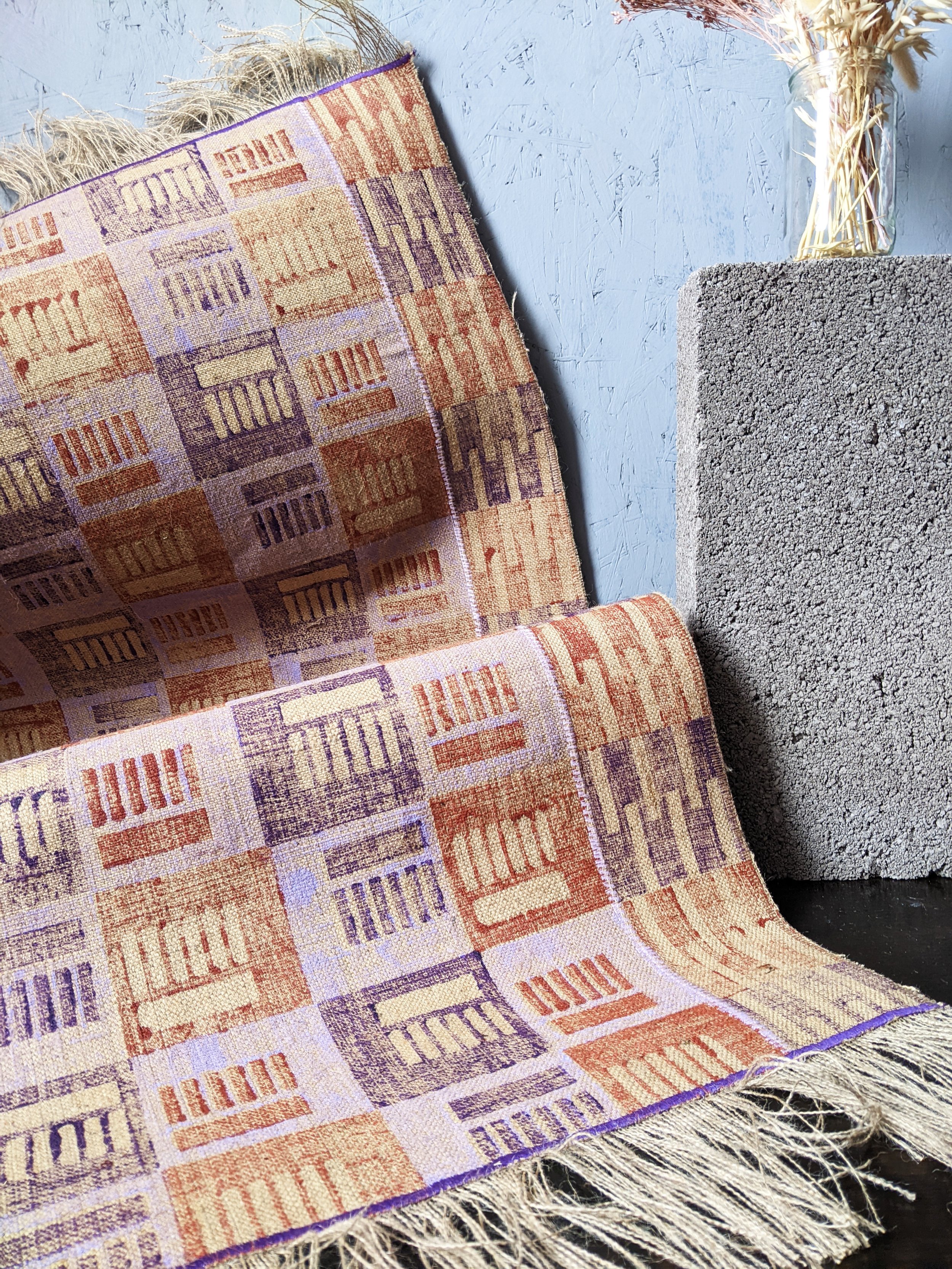 close-up detail of brutalist architecture inspired block printed rug