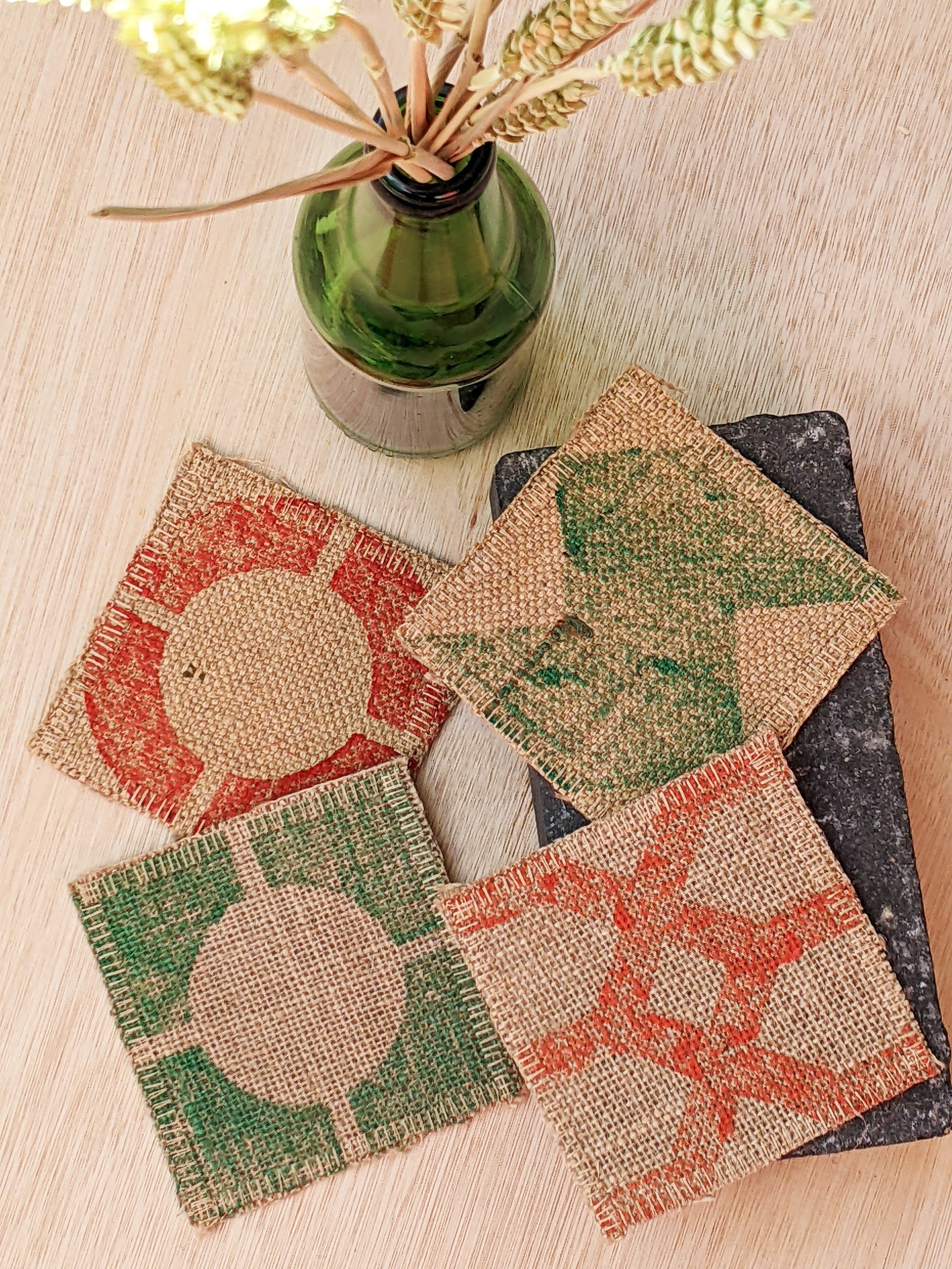 sunny kitchen table with red green block printed natural jute coasters
