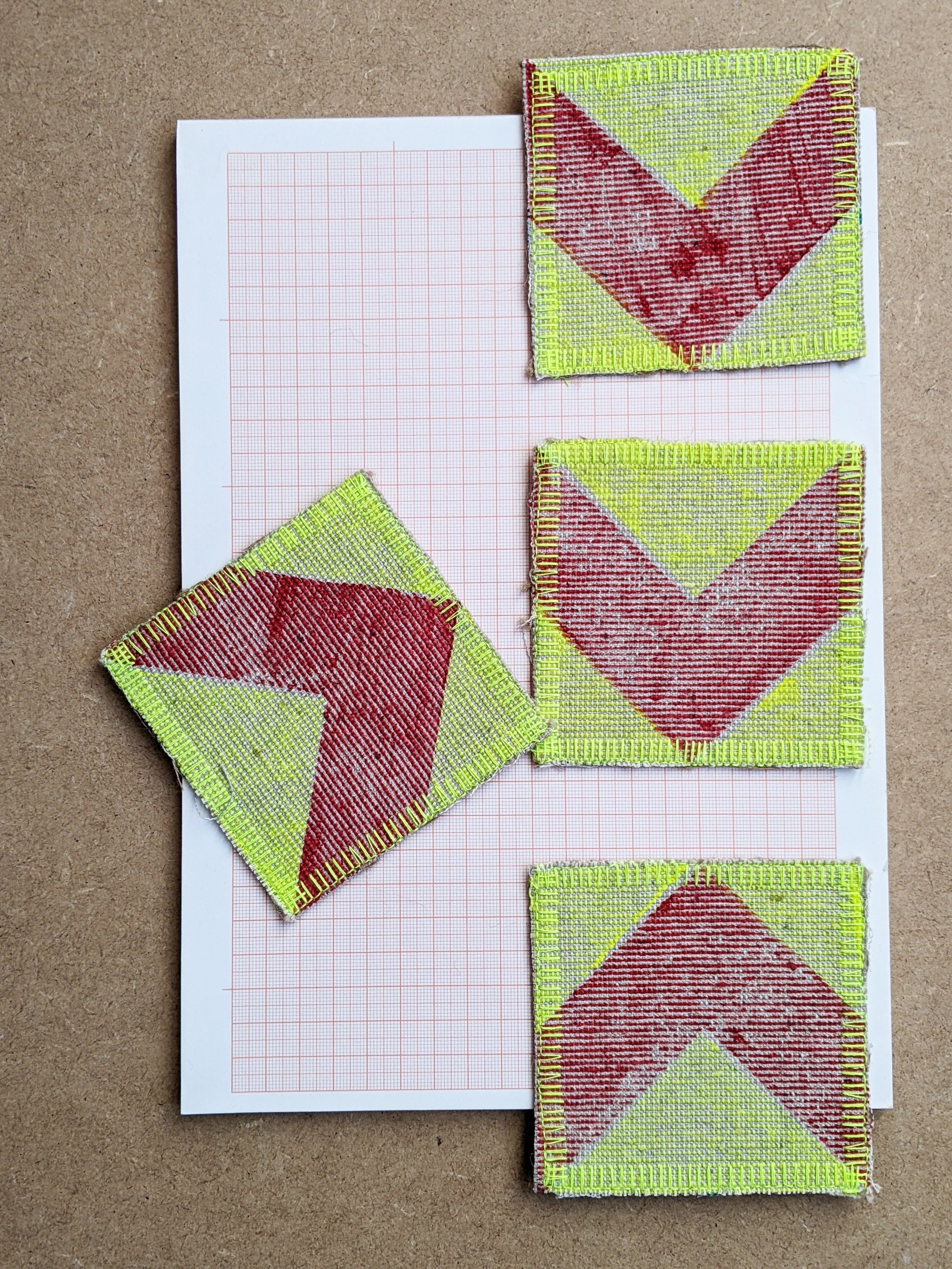 set of four red chevron print coasters with fluorescent yellow background