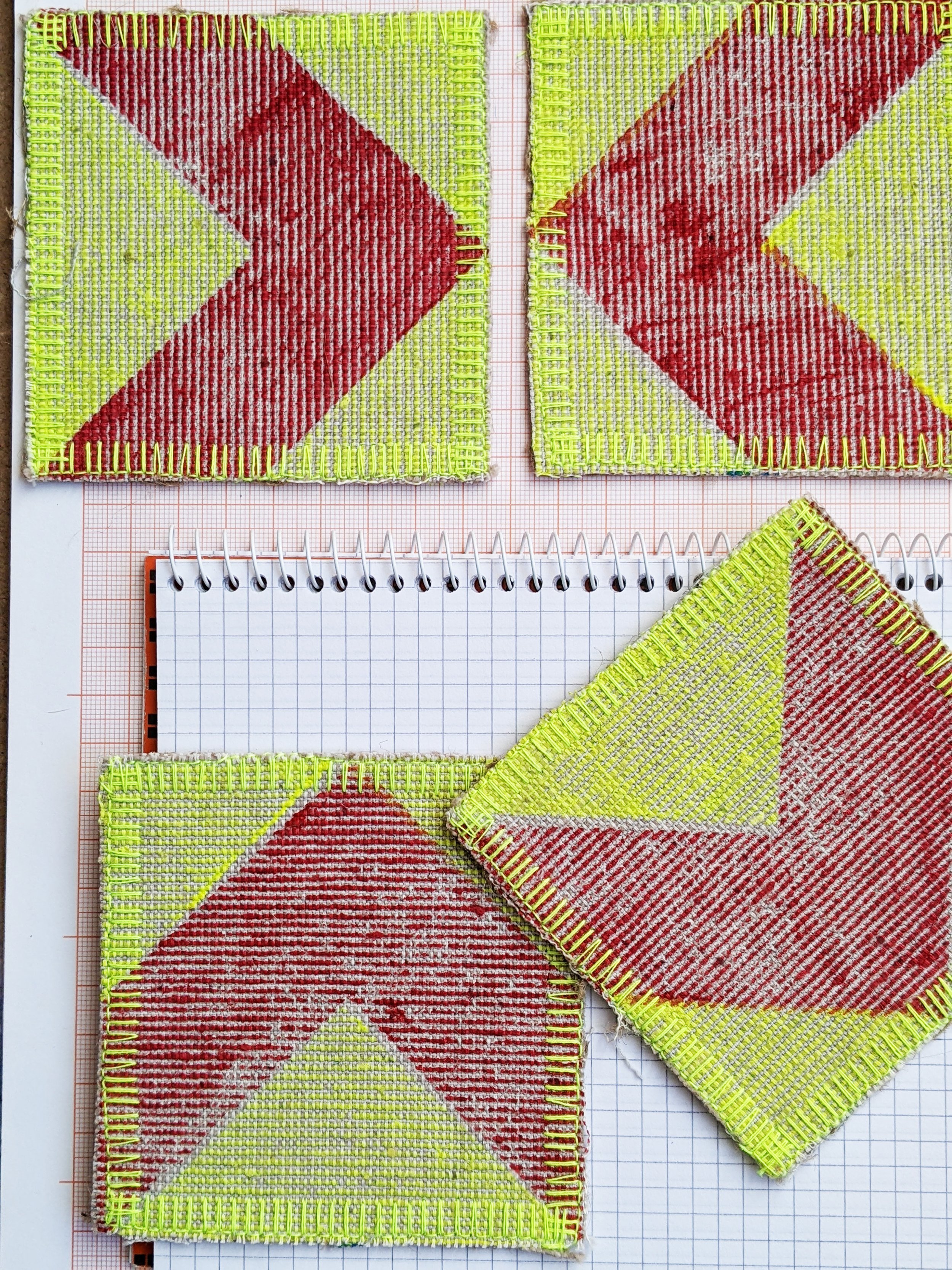 close-up detail of red chevron print with fluorescent yellow fabric coasters