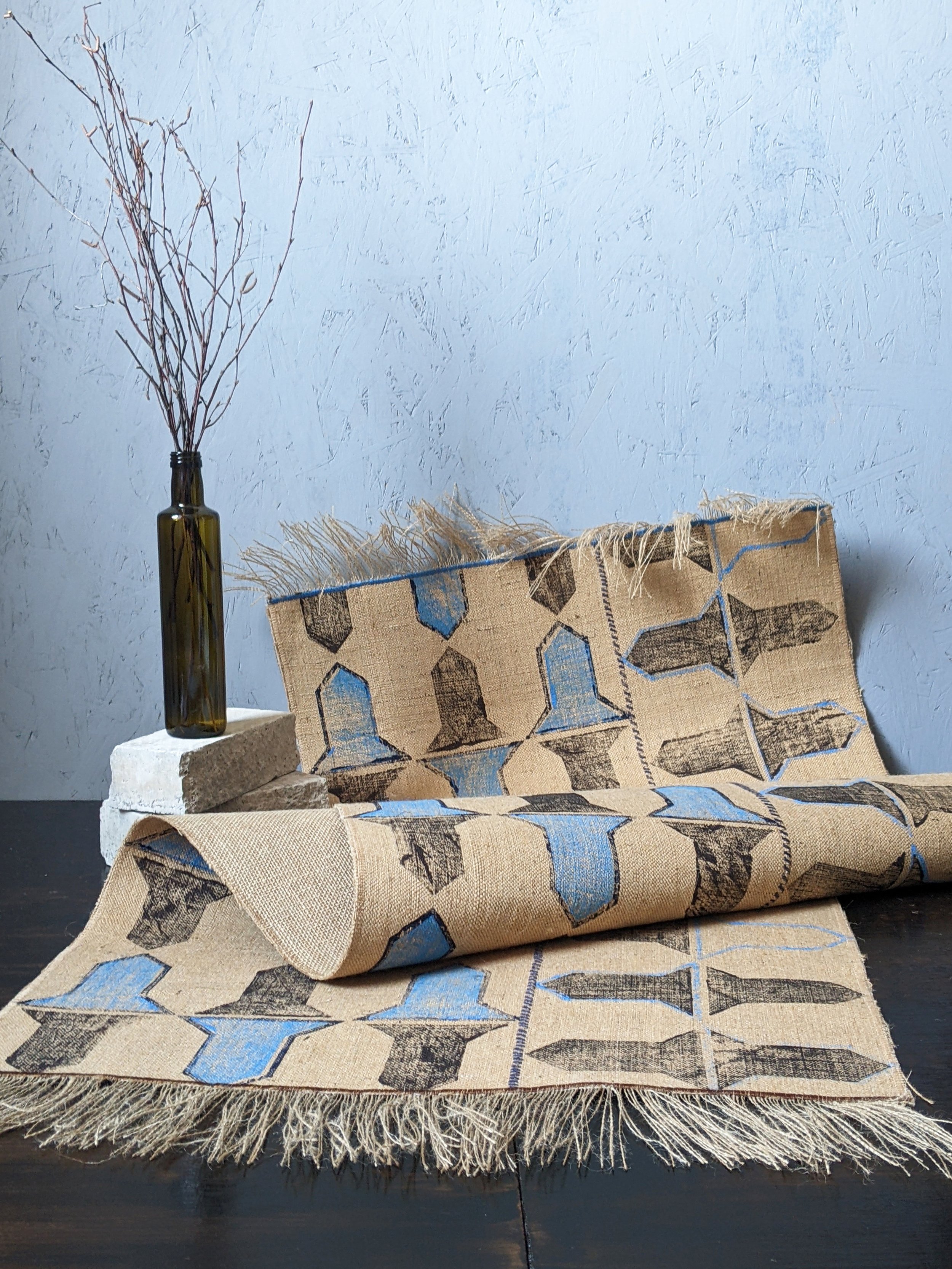 geometric hand block printed rug in contemporary studio scene