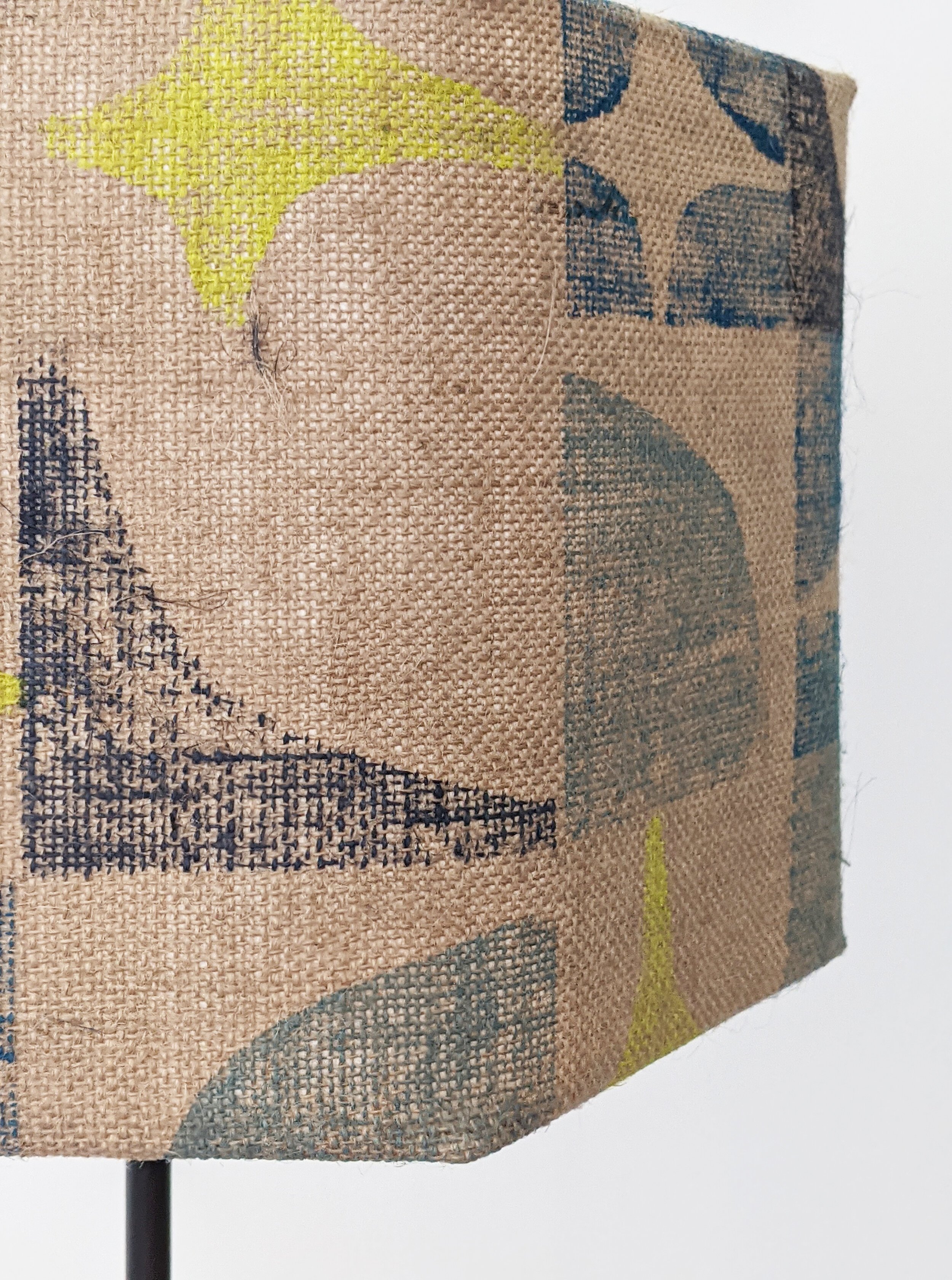 close-up-detail-of-brutalist-print-on-natural-jute-on-hexagonal-lampshade.jpg