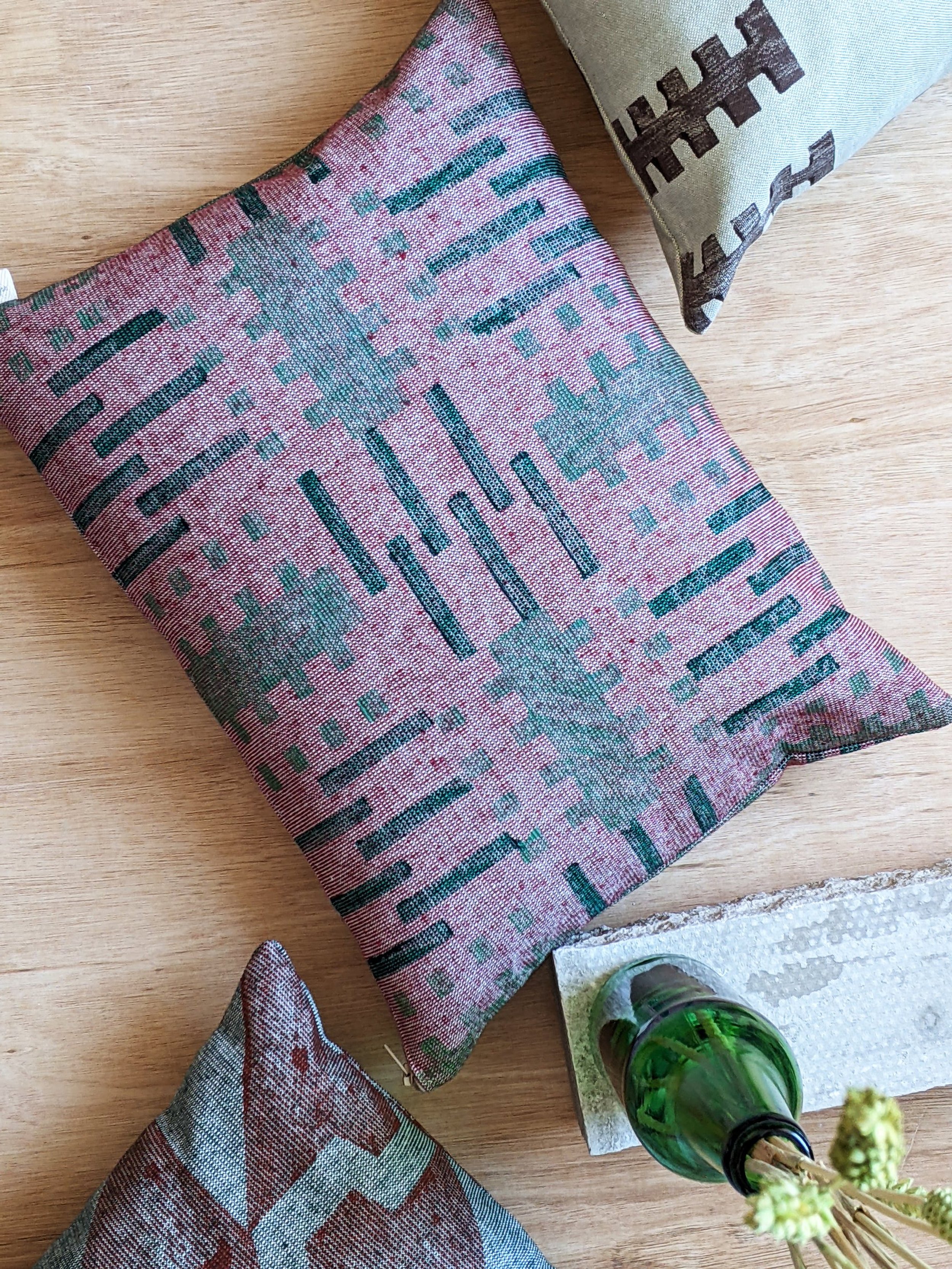 small cushion on floor in architectural pattern design resembling building blocks