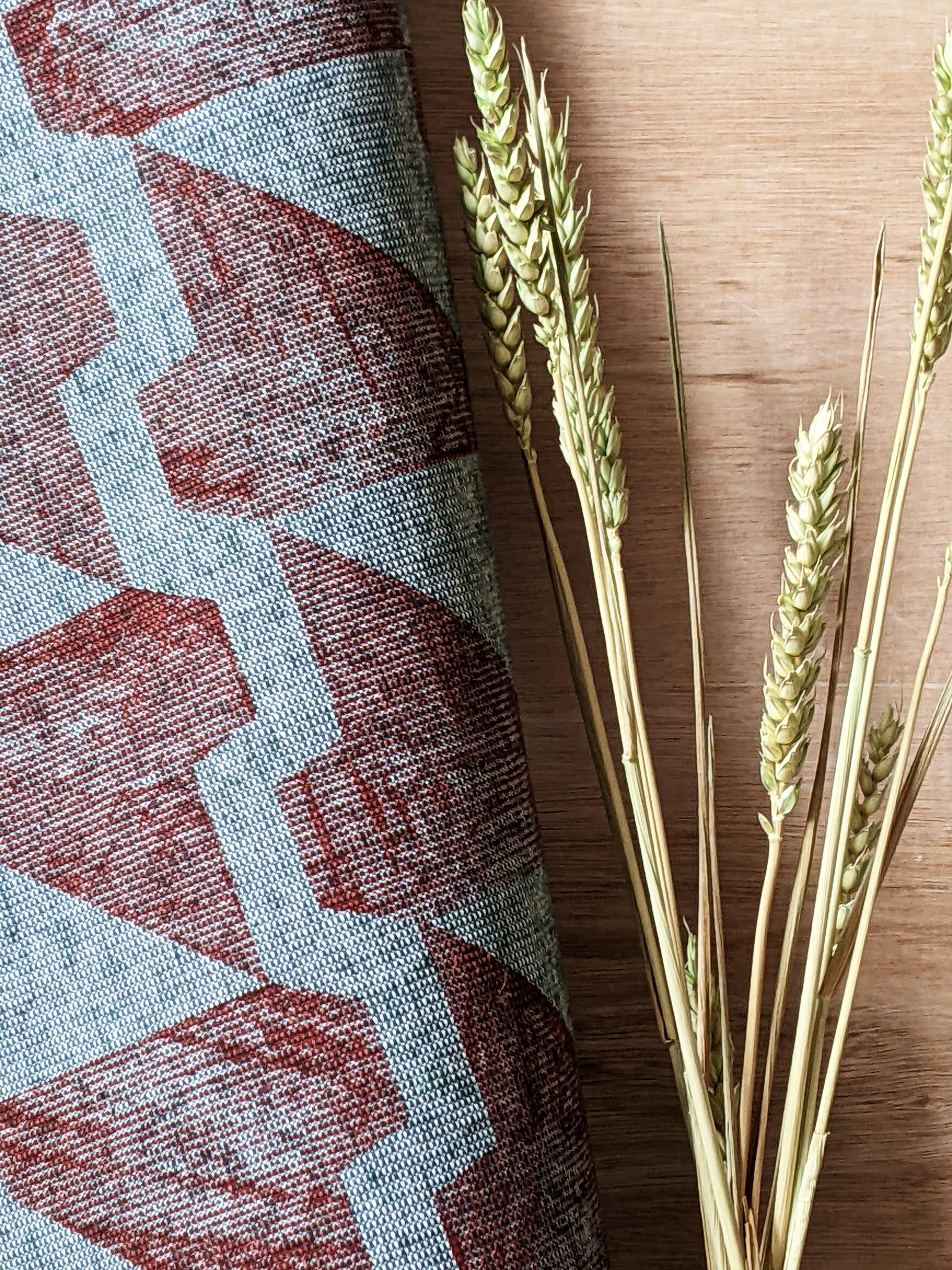 close-up detail of pattern on textured green cloth