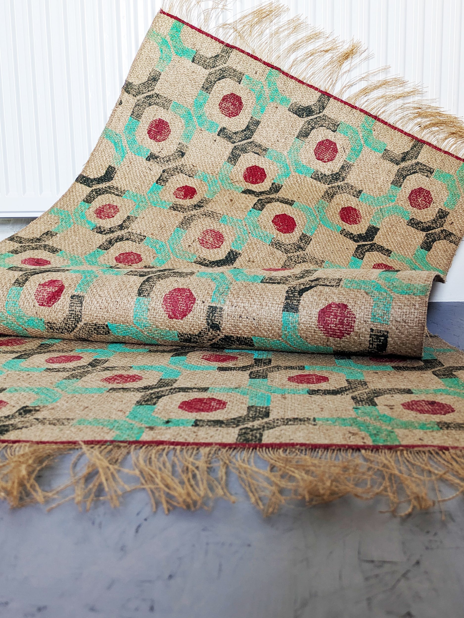 interior scene with brutalism inspired, architectural print on jute rug