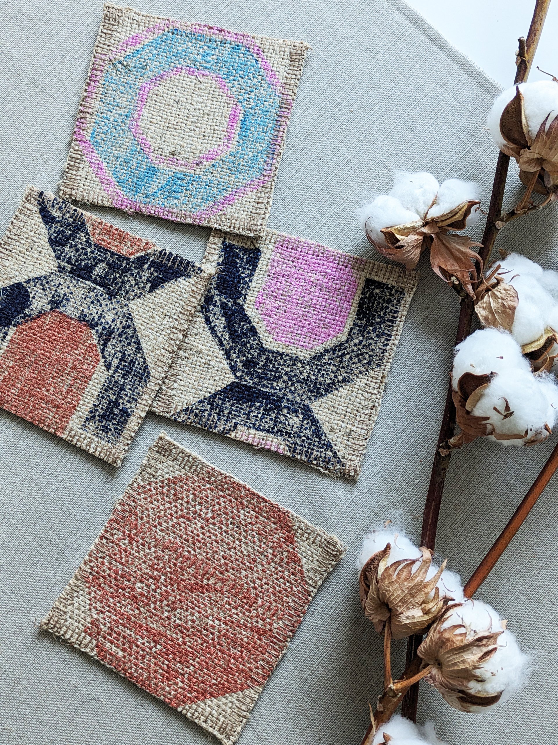 rustic effect coasters in geometric print on linen tablecloth