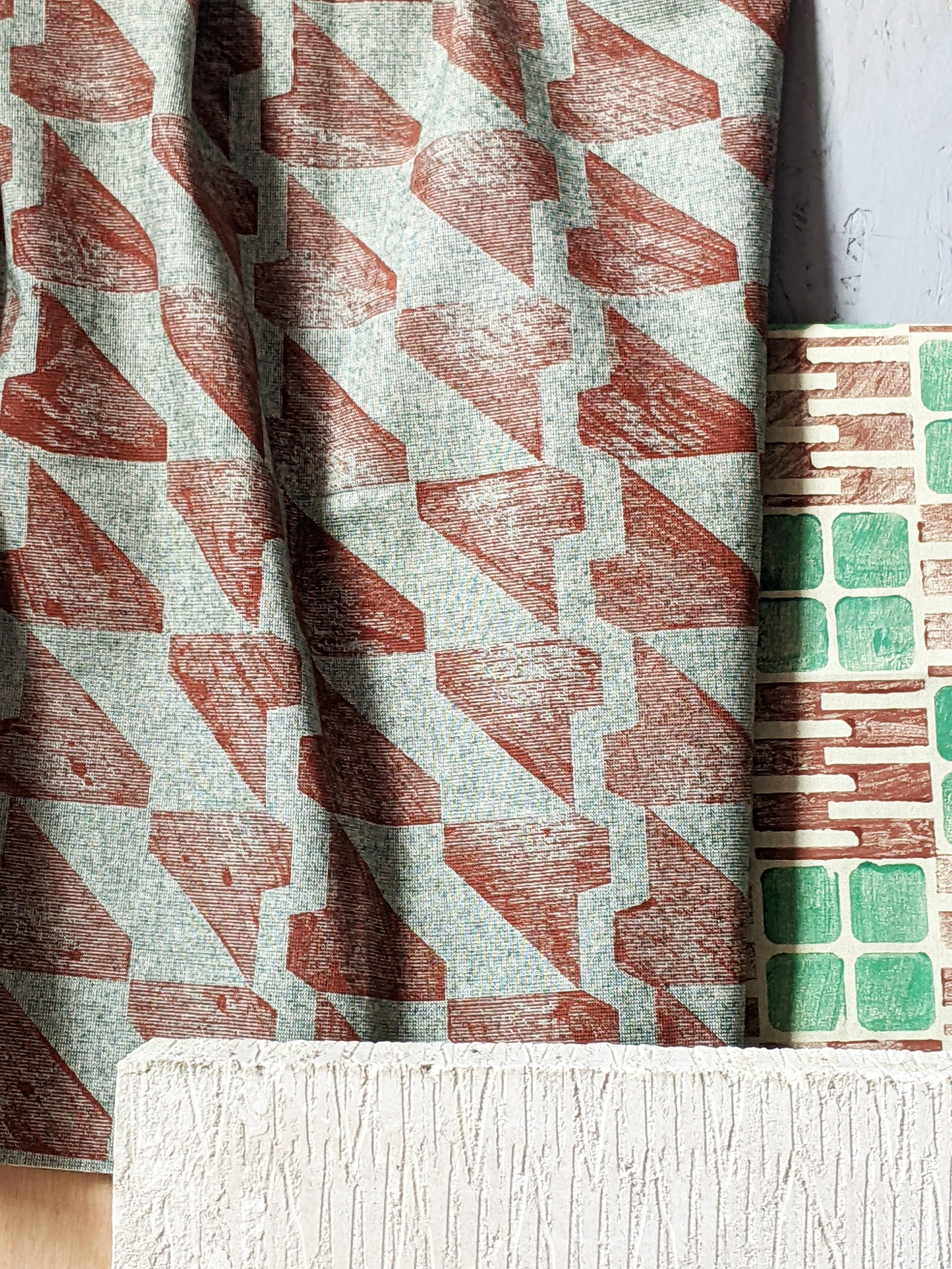 green and terracotta textile architecturally inspired geometric pattern