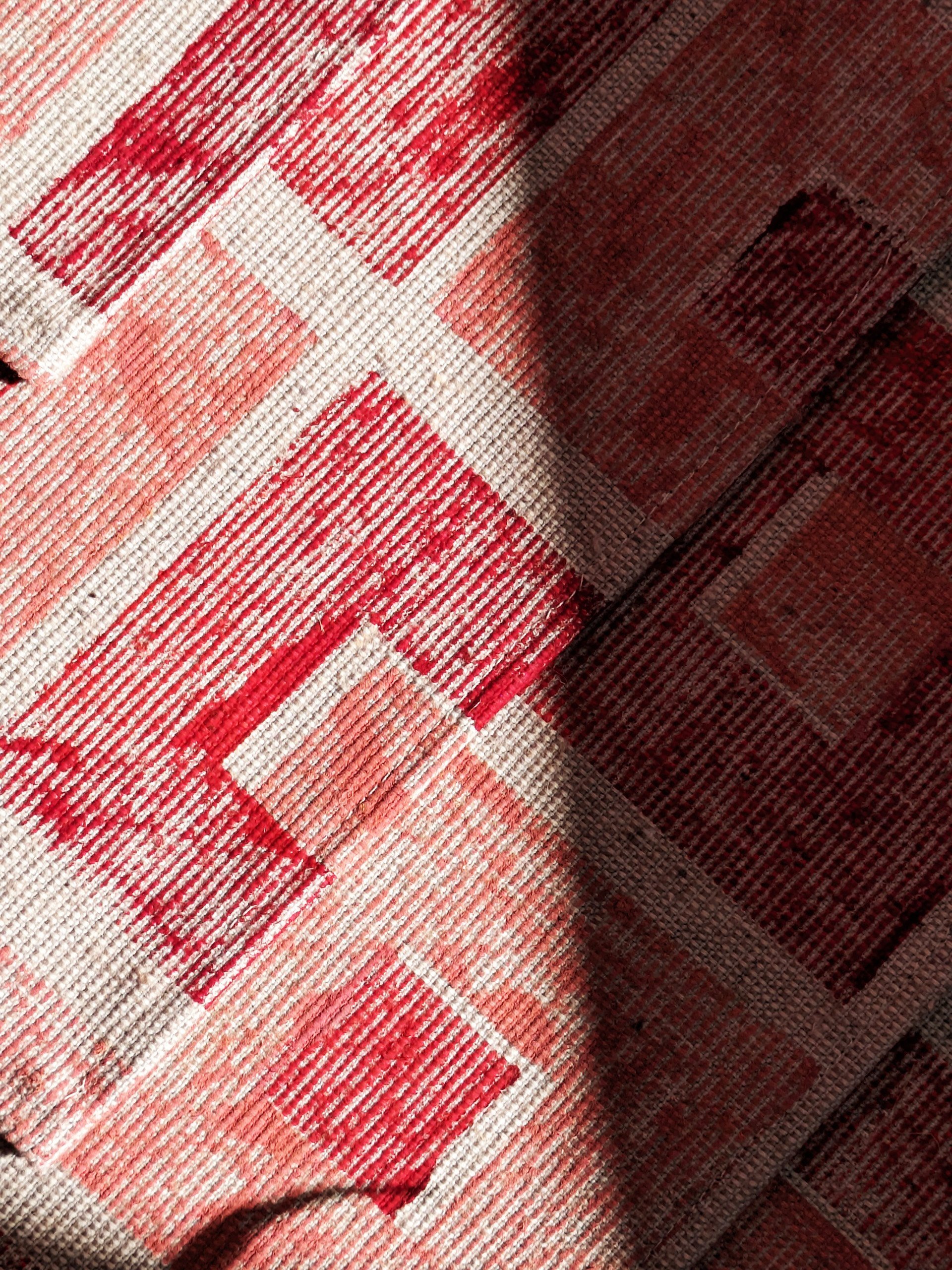close-up detail of hand block printed square pattern and texture of fabric