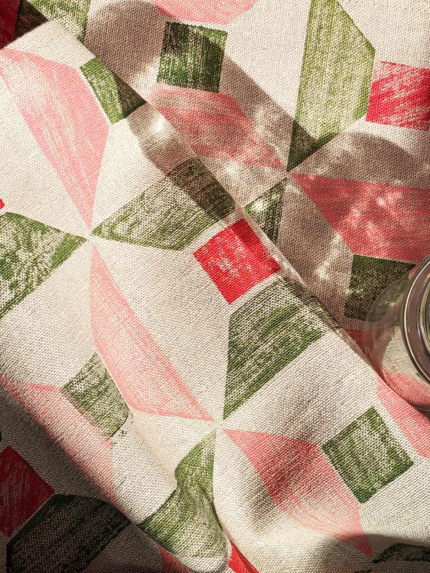 close-up detail of rustic linen fabric with architectural geometric print