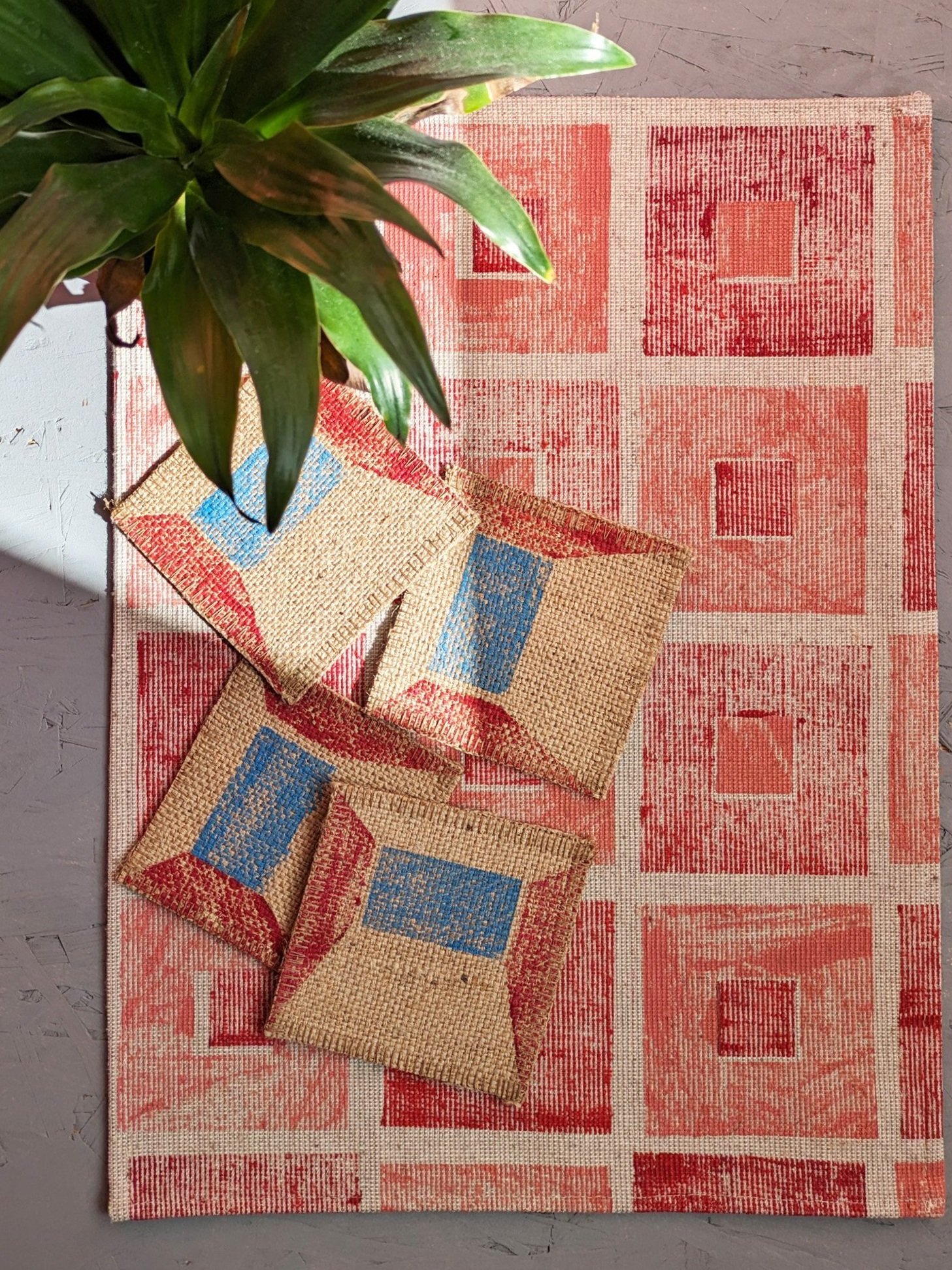 sunny tropical kitchen scene with block printed abstract geometric fabric coasters and place mat