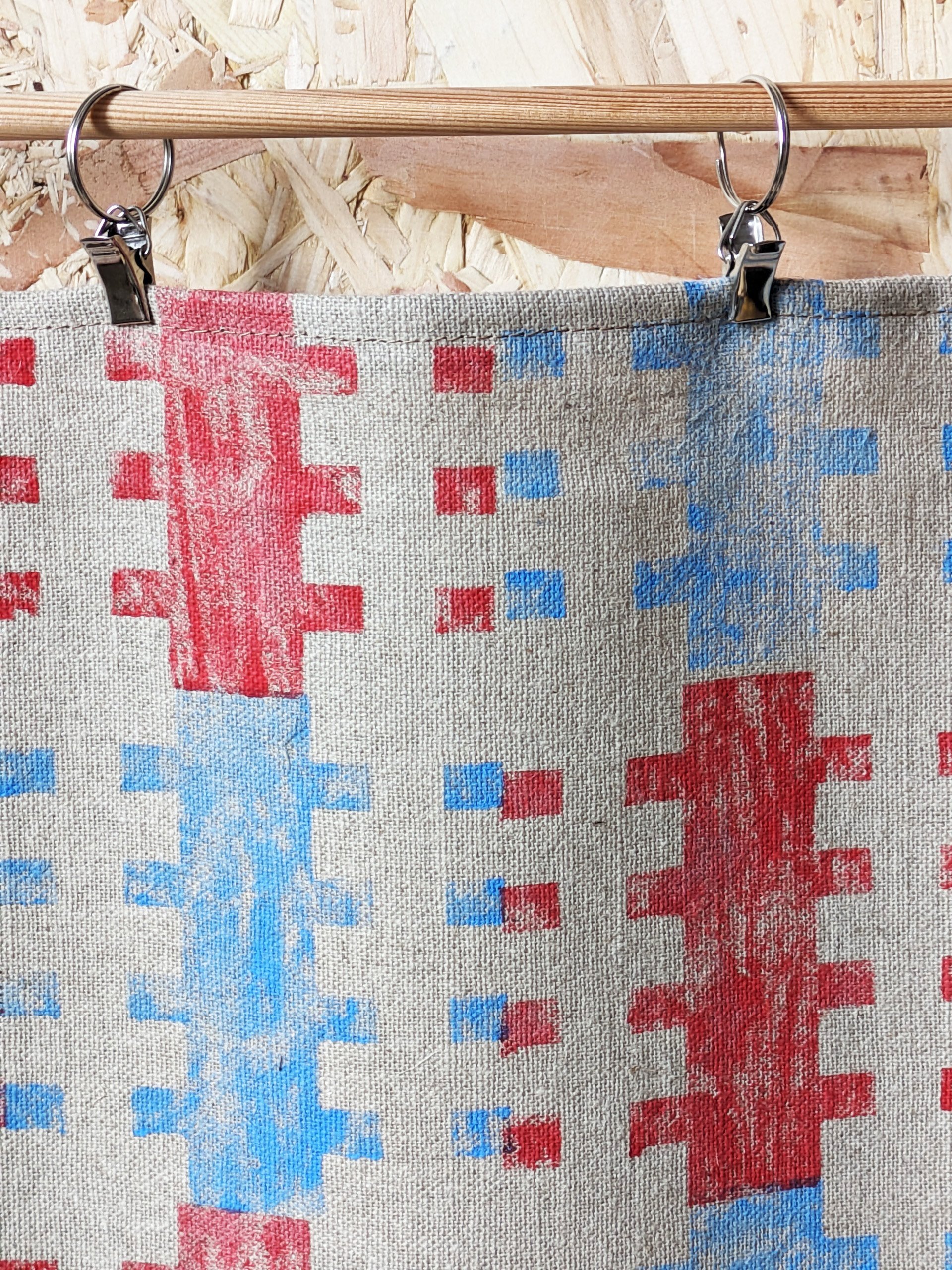 close-up detail of wall hanging with blue and red geometric print