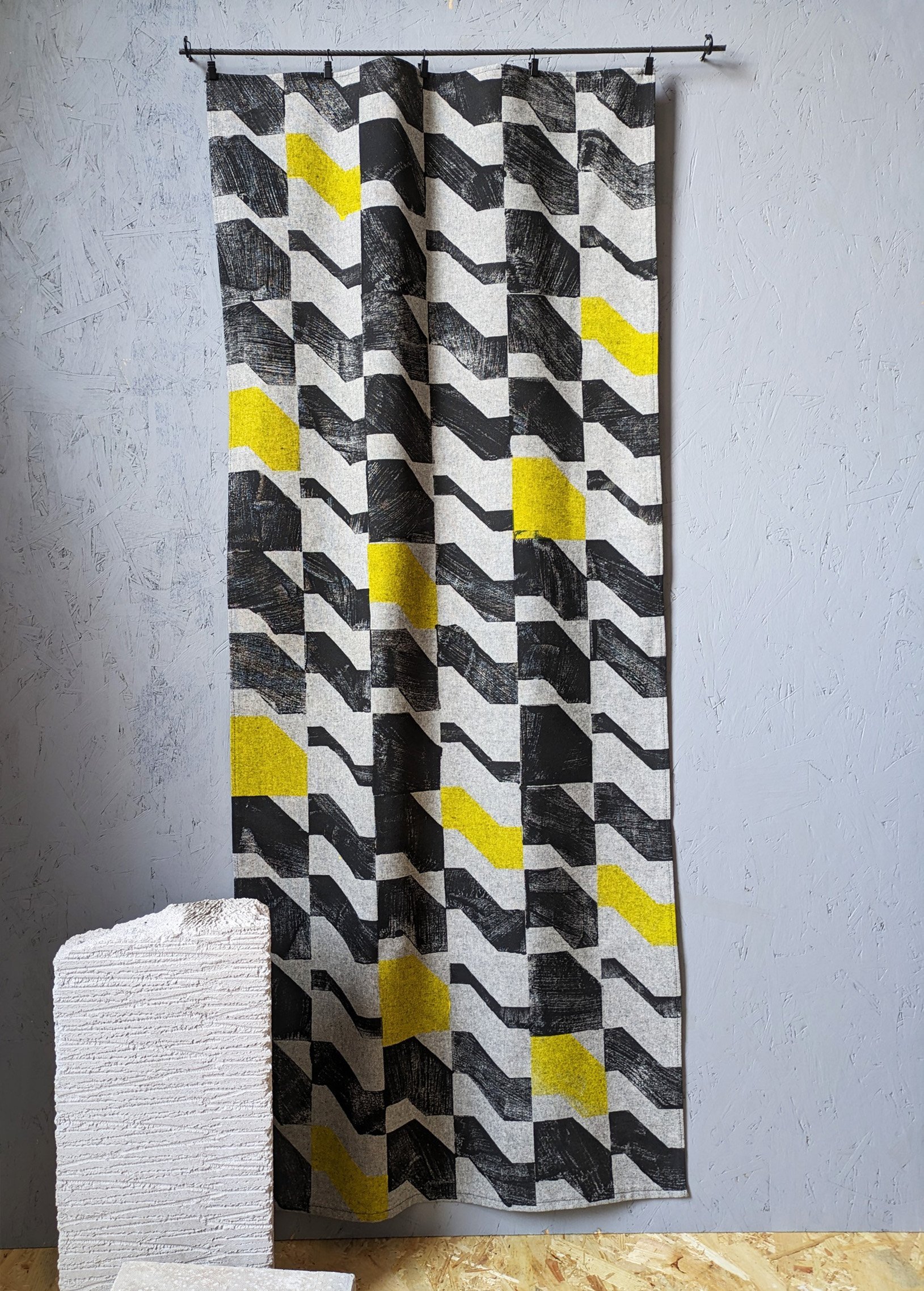 brutalist architectural wall hanging with rhythmic pattern and strong contrast