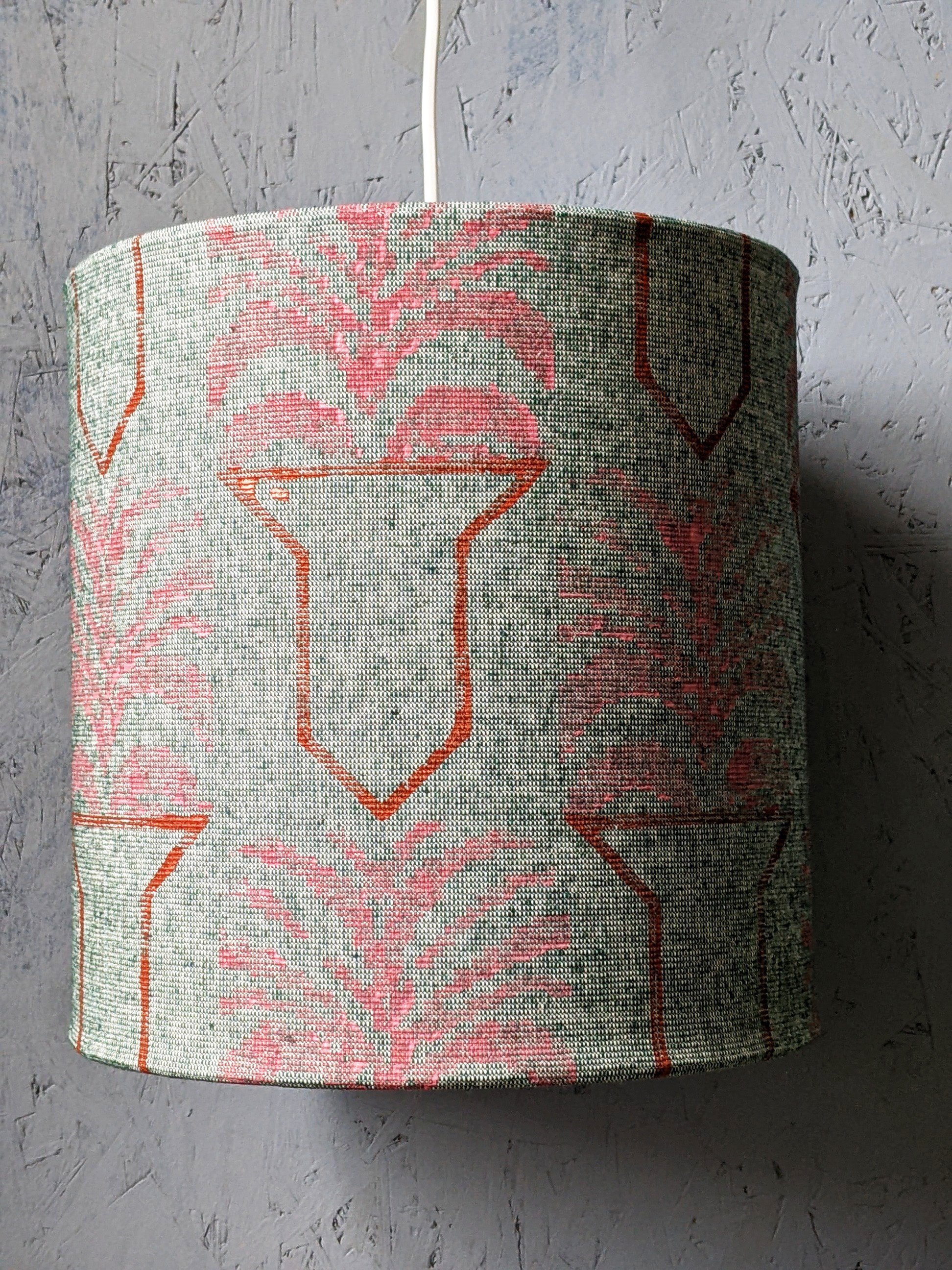 pastel pink and copper geometric print on green drum lampshade