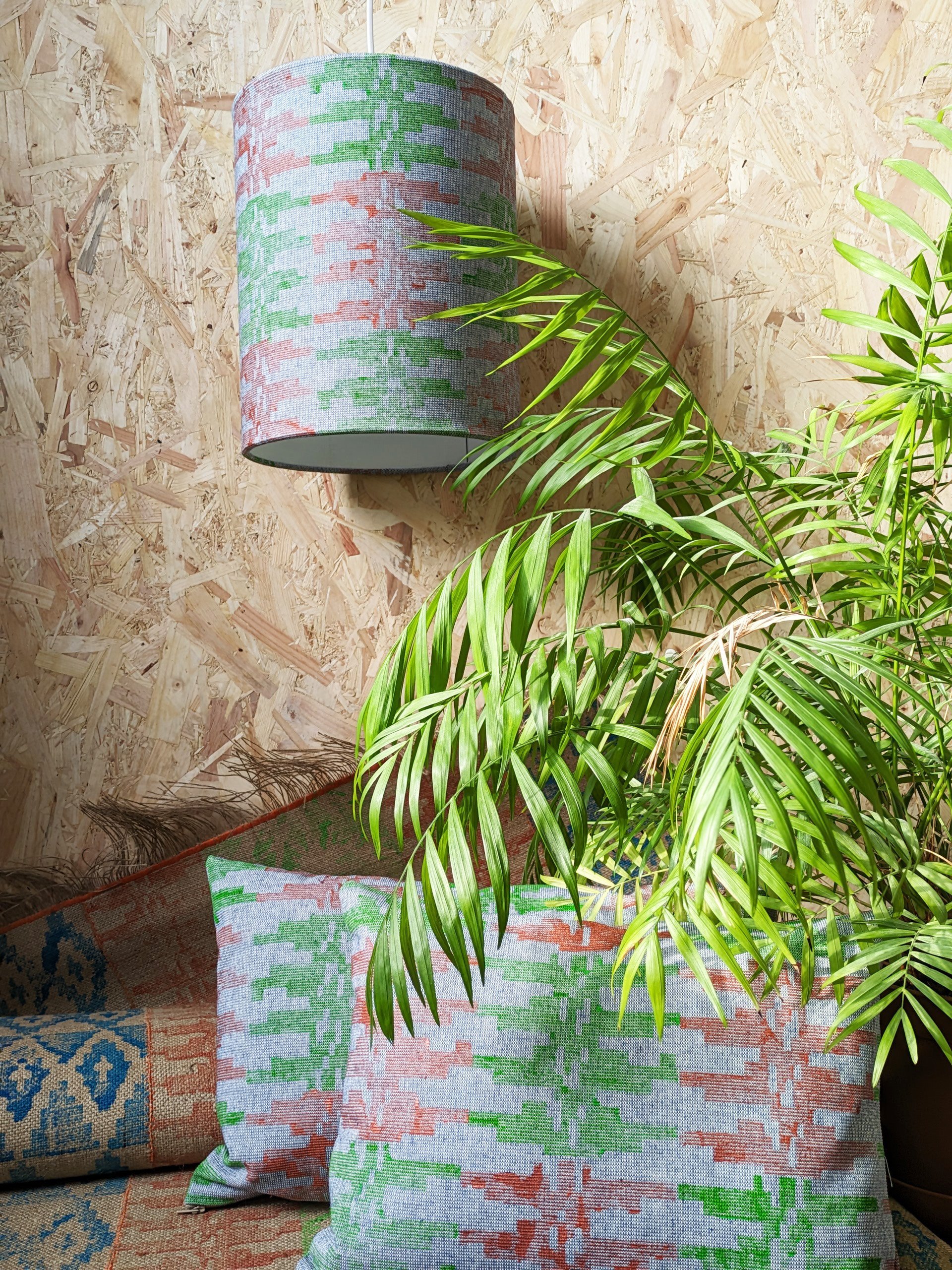 studio scene with boho decor, rug, cushions and lampshade with block printed details