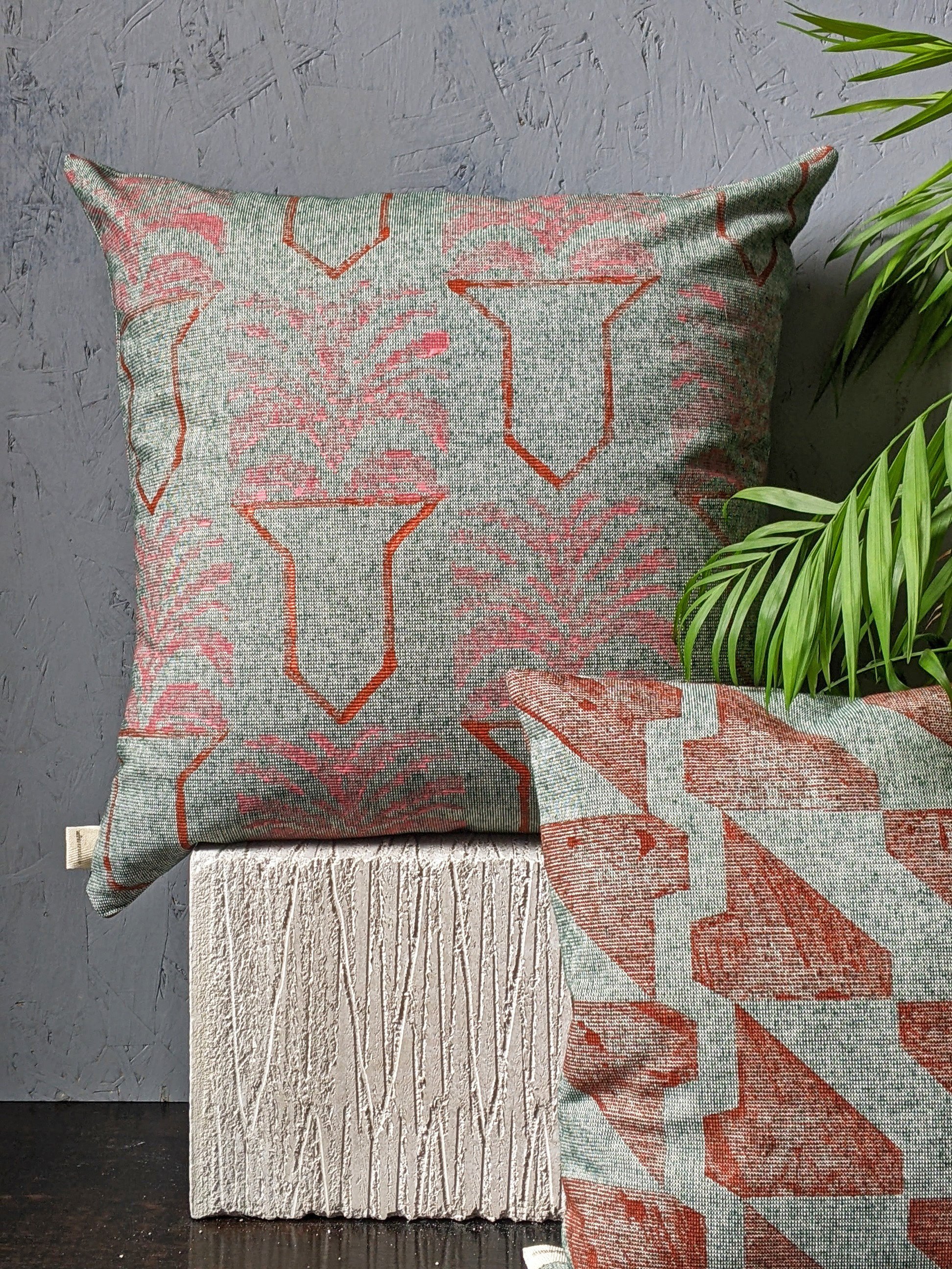 studio scene with eclectic cushions made of green textured fabric and block printed patterns