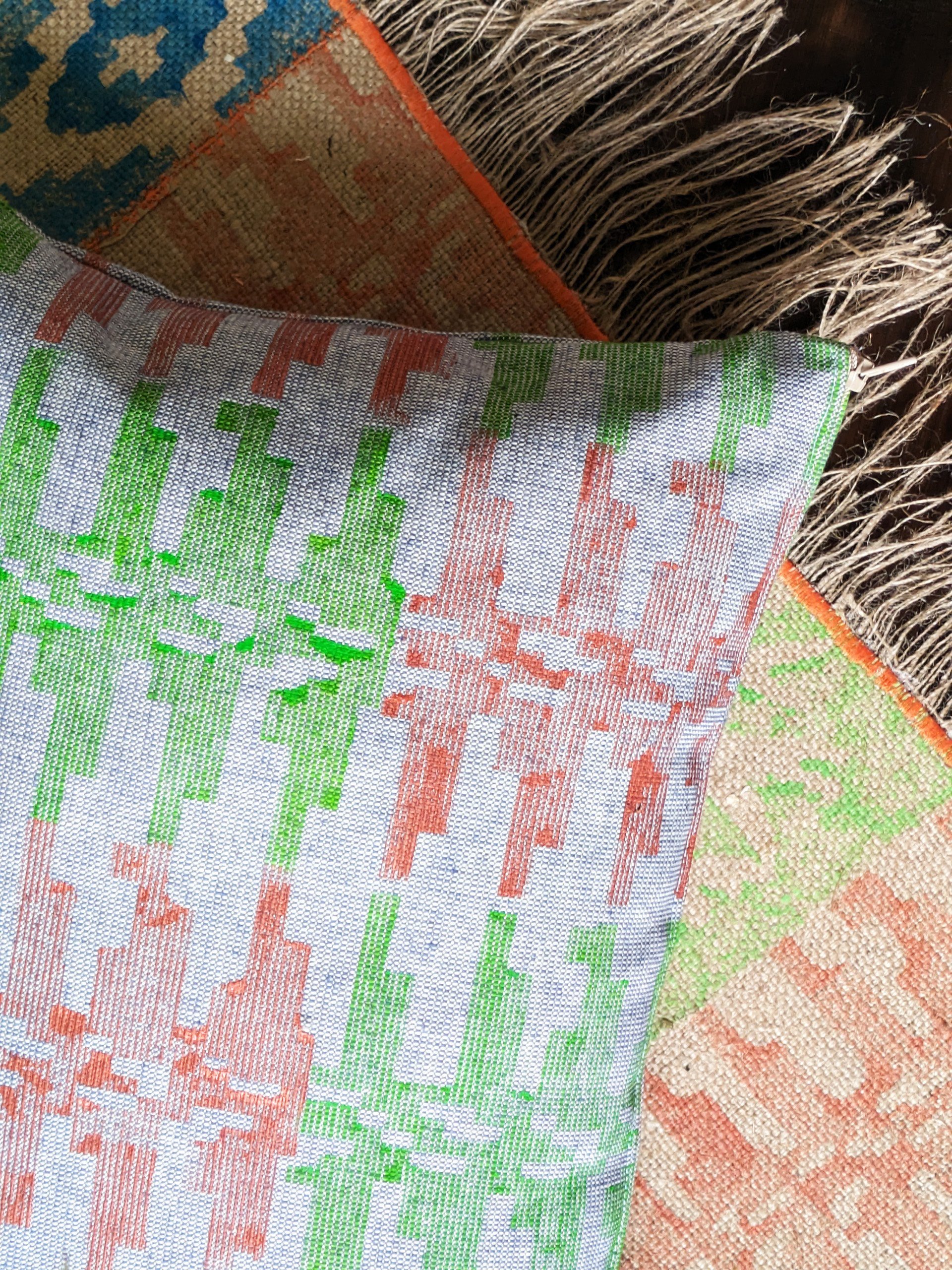 close-up detail of textured denim-like fabric and block printed pattern