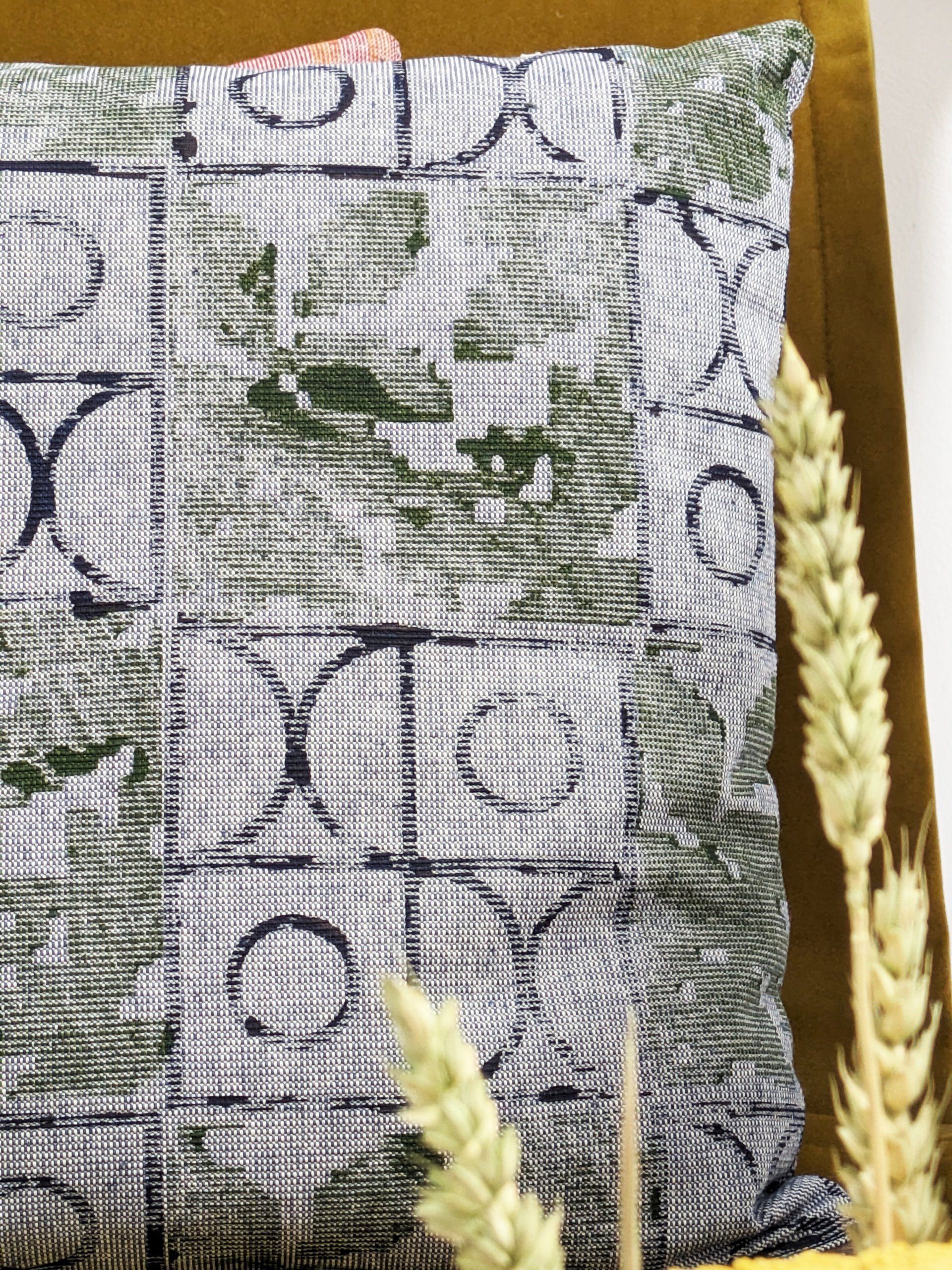 navy blue and olive print on denim-like cotton fabric of cushion
