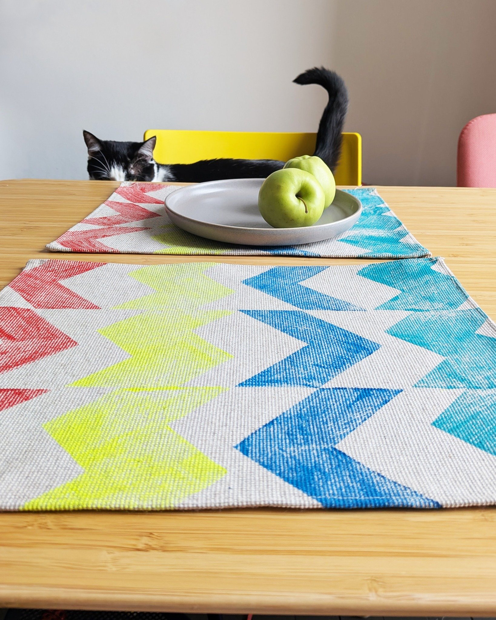 summer 🌞 with macska checking out the latest stock - there are some slow new additions to the line such as these small place mats / kitchen towels. this was one of the first "collections" i have designed and the vibrant summer colours are 