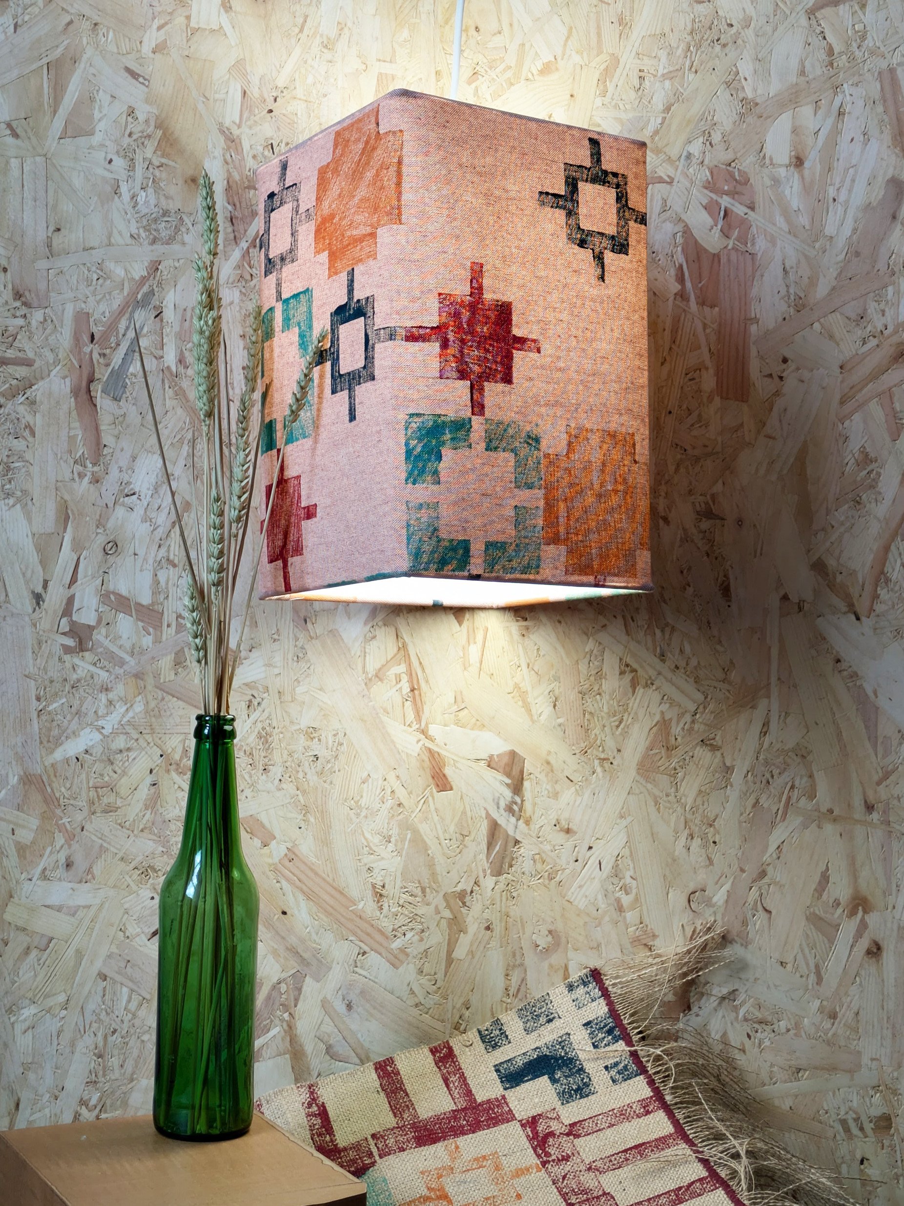cosy ambient light with funky square print design on geometric orange lampshade