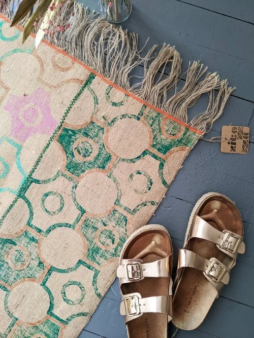 jute rug on floor with vintage deco inspired print