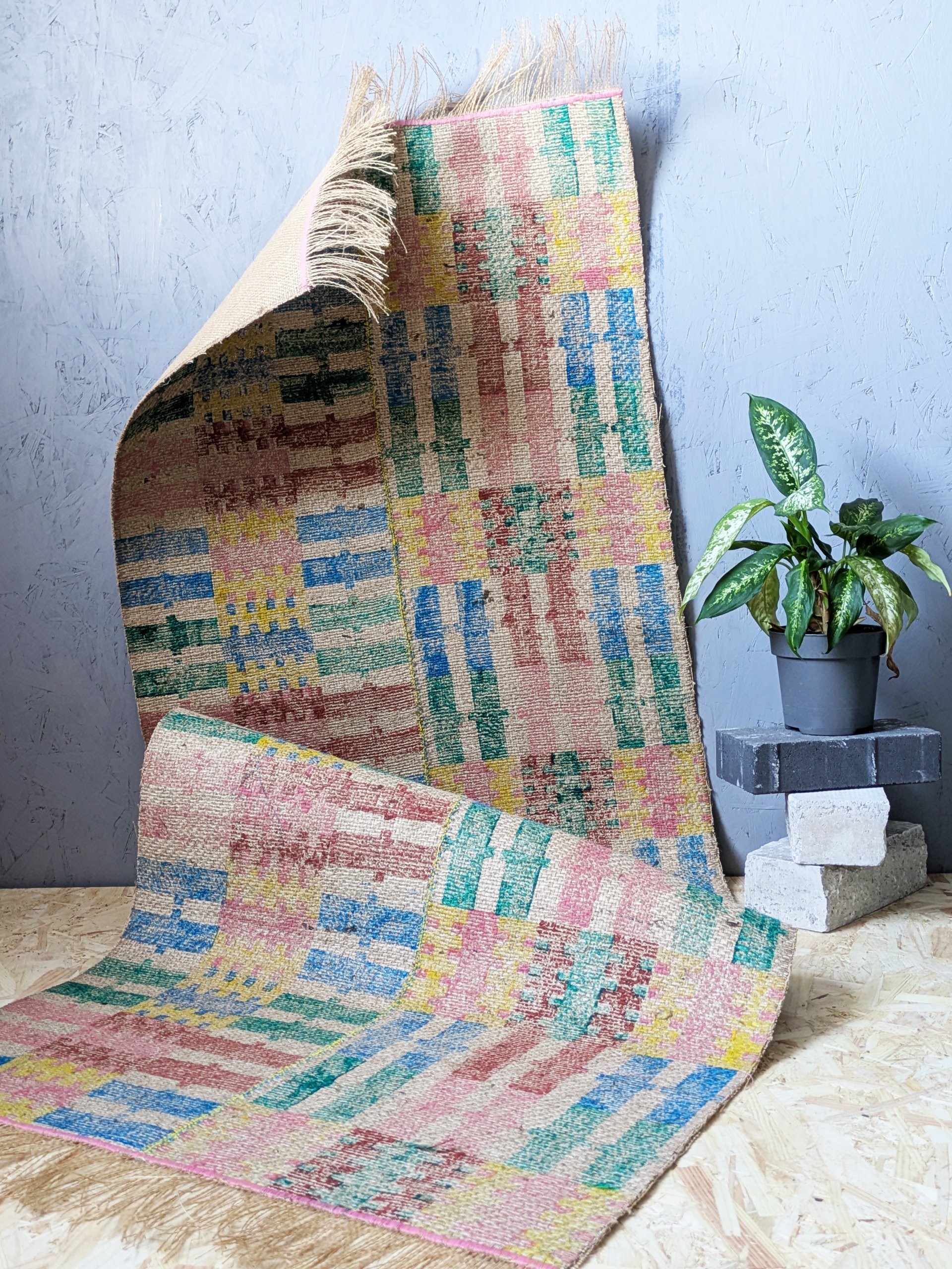 studio scene with jute rug with bold and pastel, summery stripes