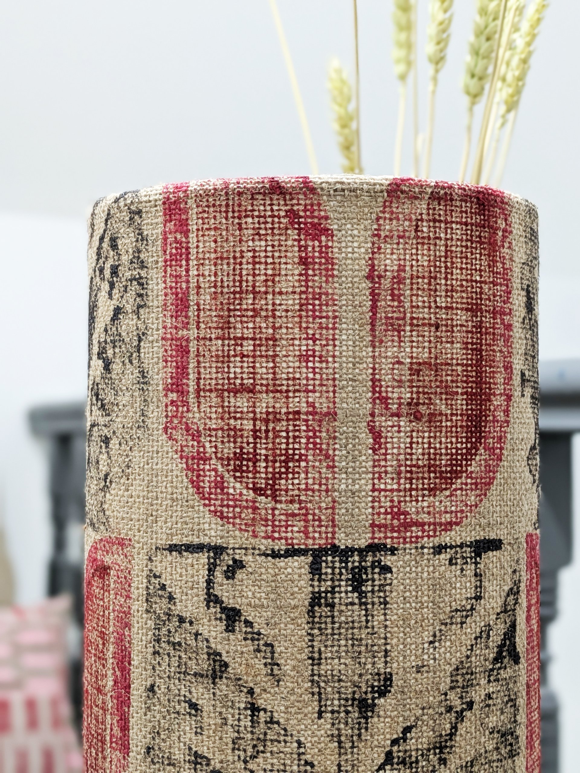 close-up detail of retro inspired tulip motif on rustic jute lampshade