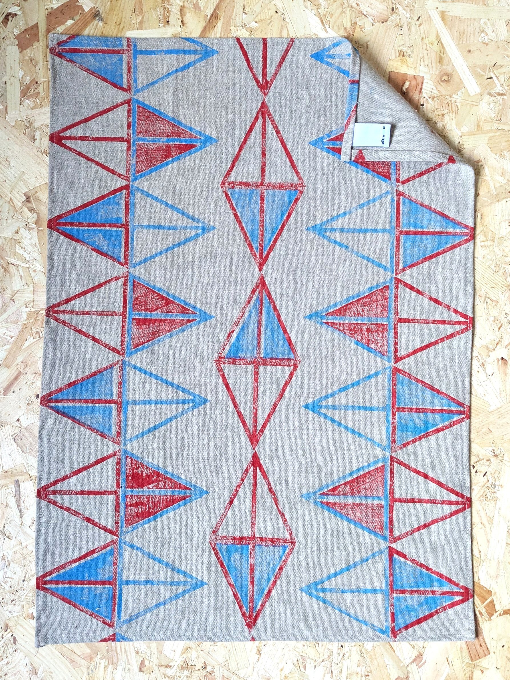 abstract geometric print on linen teatowel in playful, modern triangular pattern