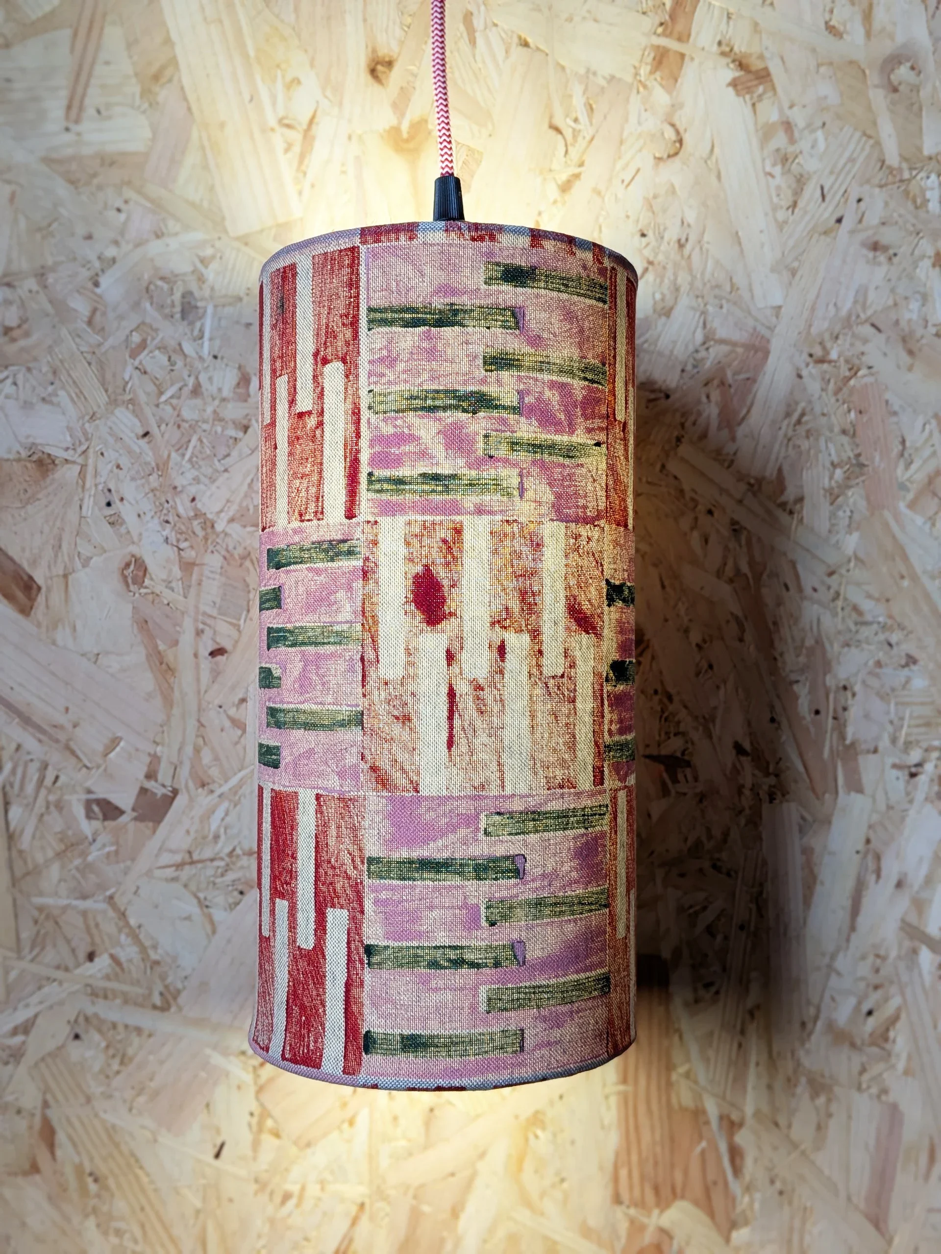 pink and red geometric print on mid-century inspired long lampshade