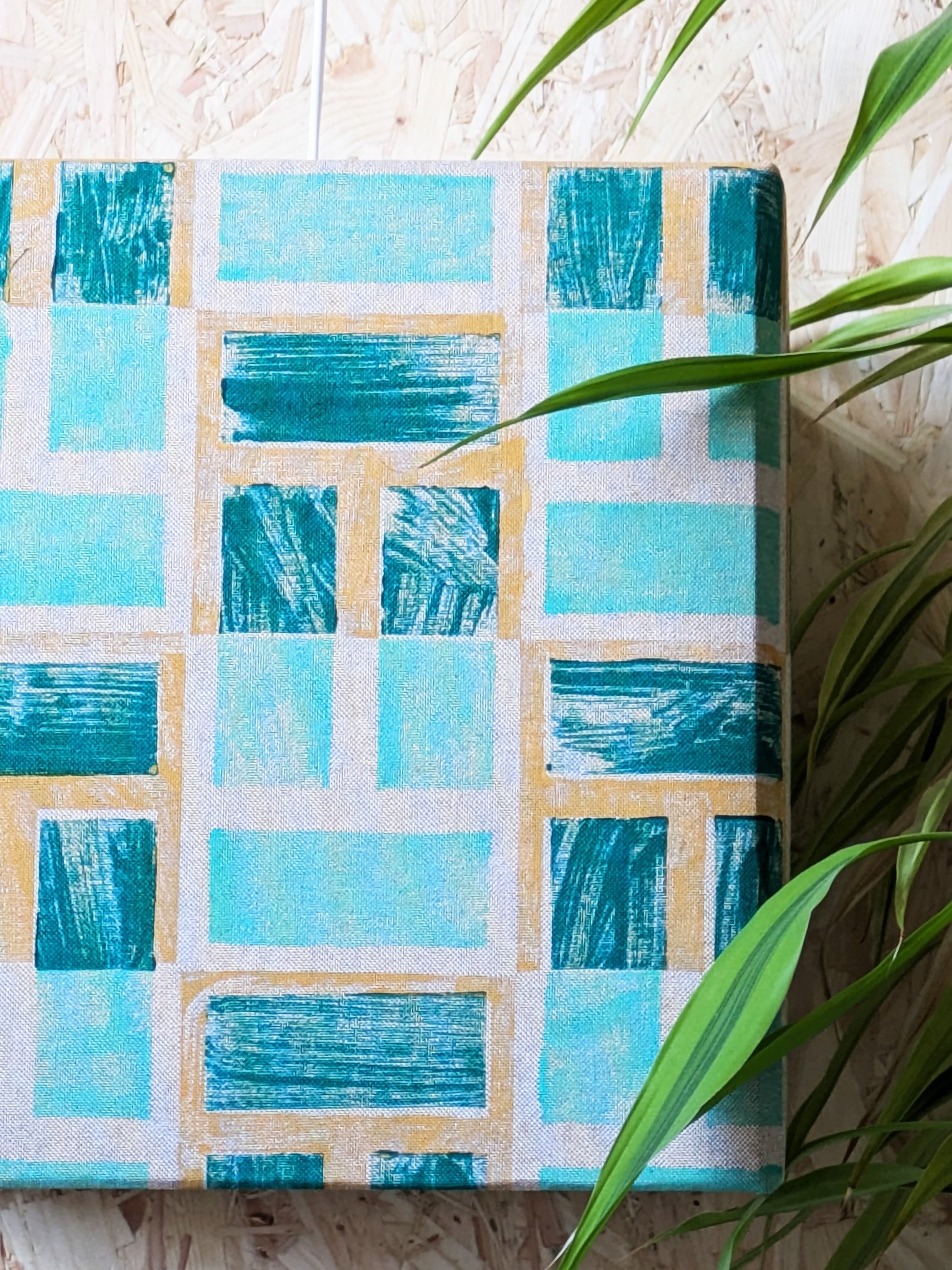 close-up details of hand block printed pattern in lush green colours on contemporary cubical lampshade