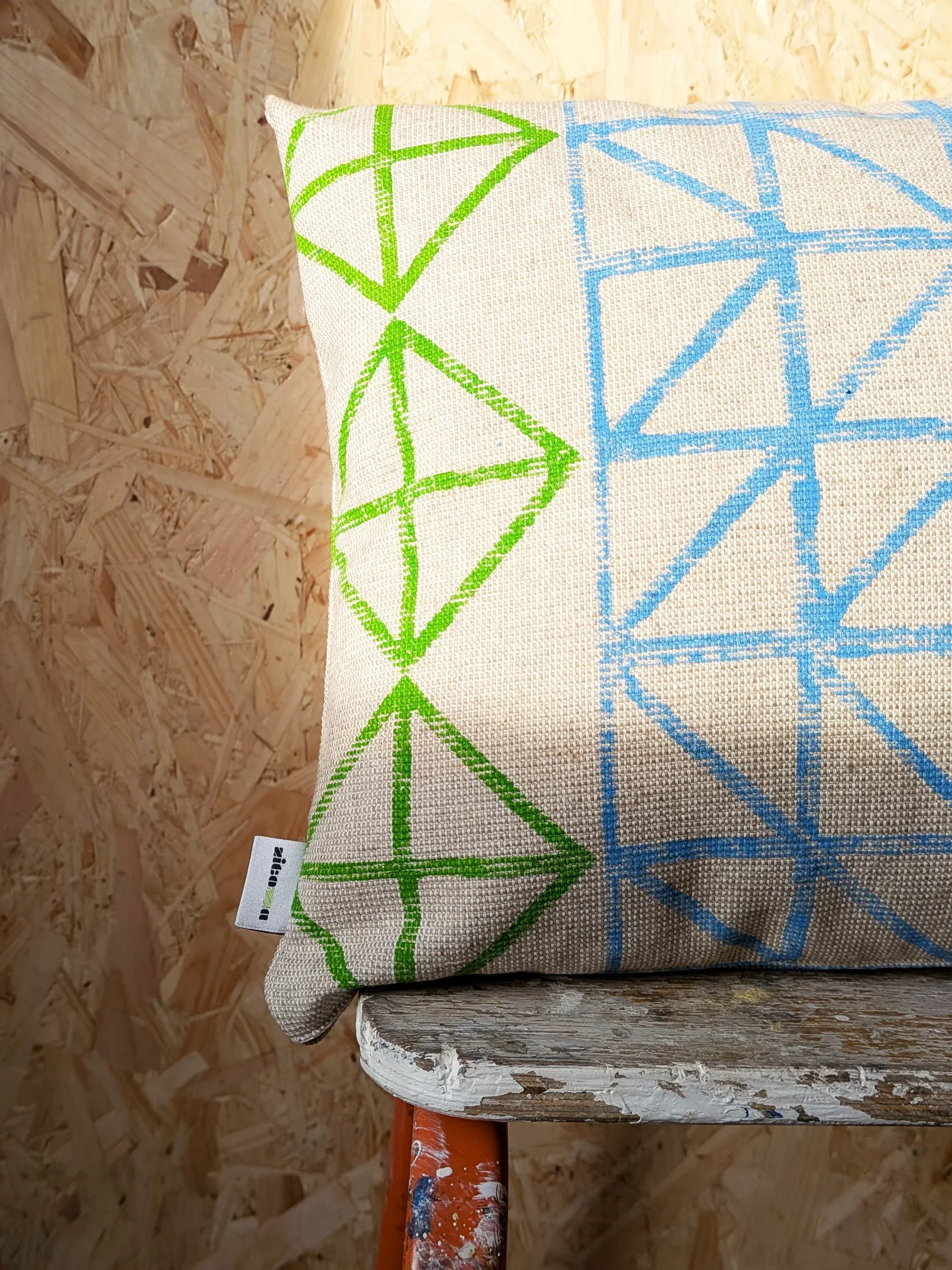 colourful block printed industrial pattern on small cushion