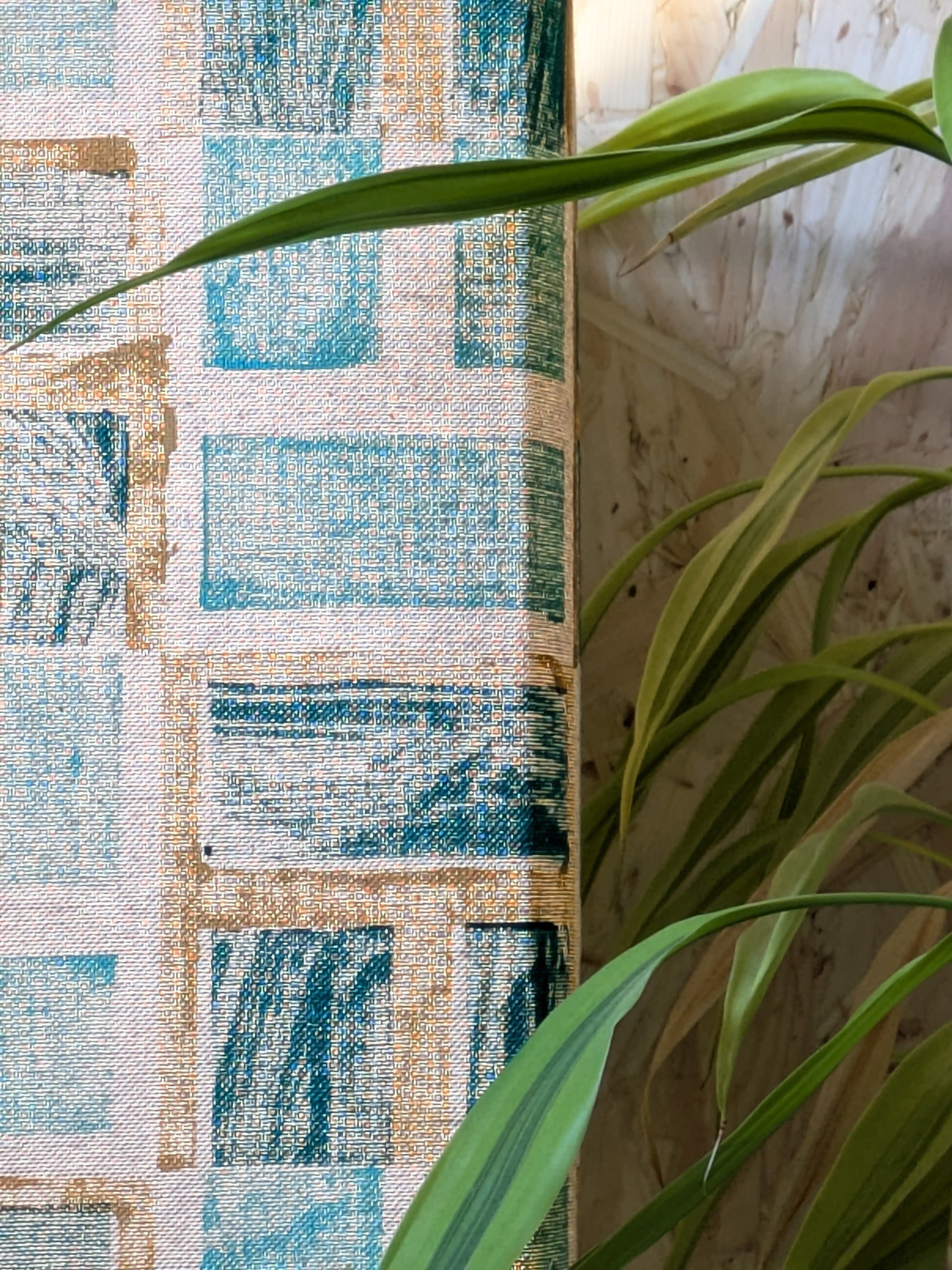 close-up details on lit-up lampshade with geometric lush green print design