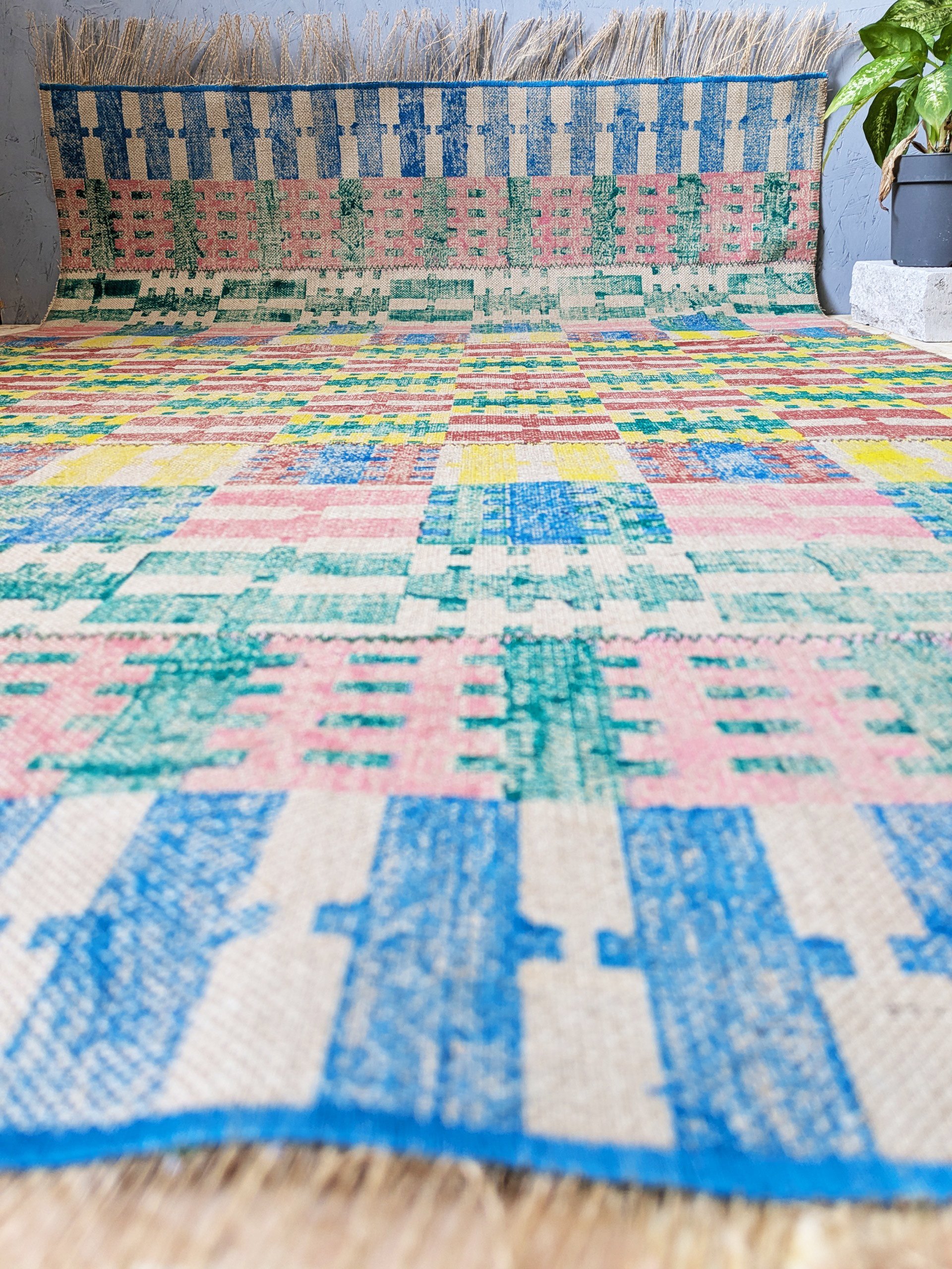 studio scene with bold striped printed jute rug on floor