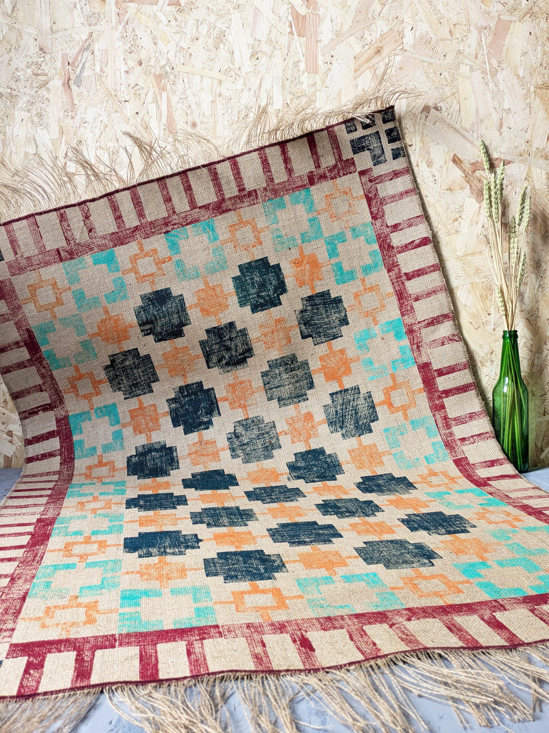 pixel-inspired geometric pattern on handmade jute rug